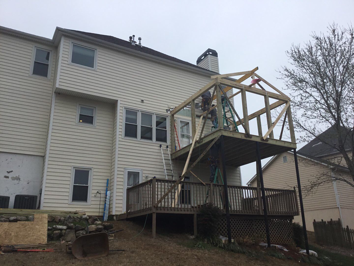 Two-Story Pressure Treated Wood Deck and Porch Addition in Marietta by Swift Home Renovations