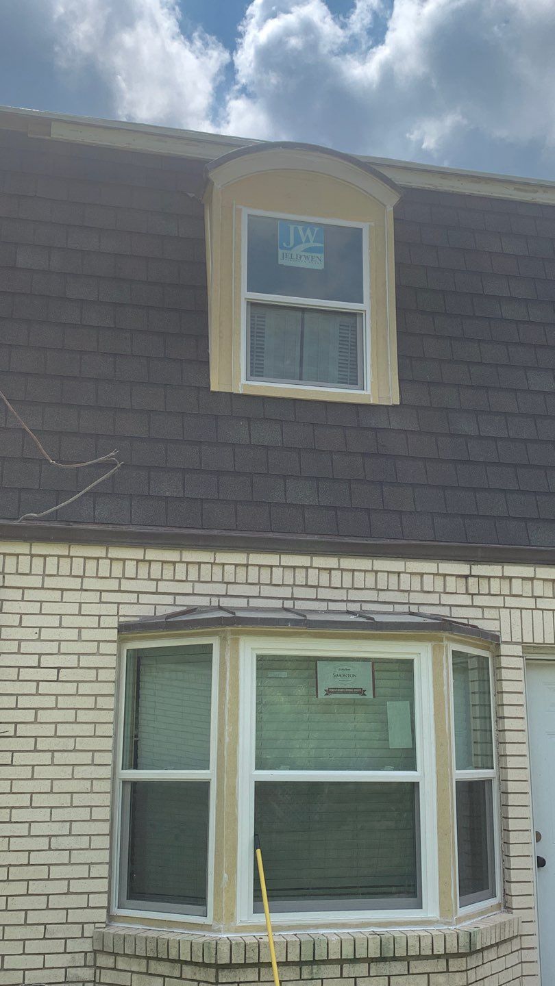 Mansard Charm by Bayfront Roofing and Construction