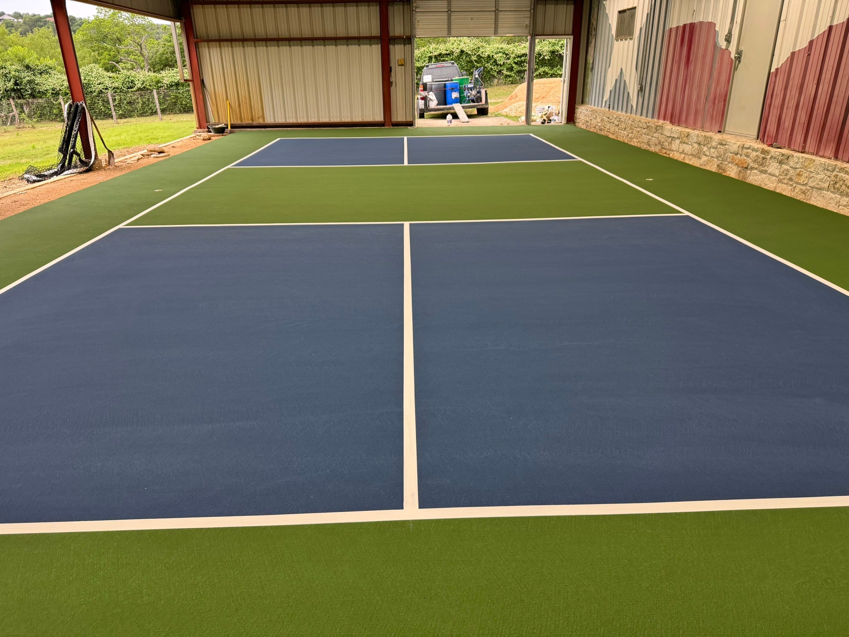 Pickleball Court in Barn on Lake Austin by Sport Court Austin