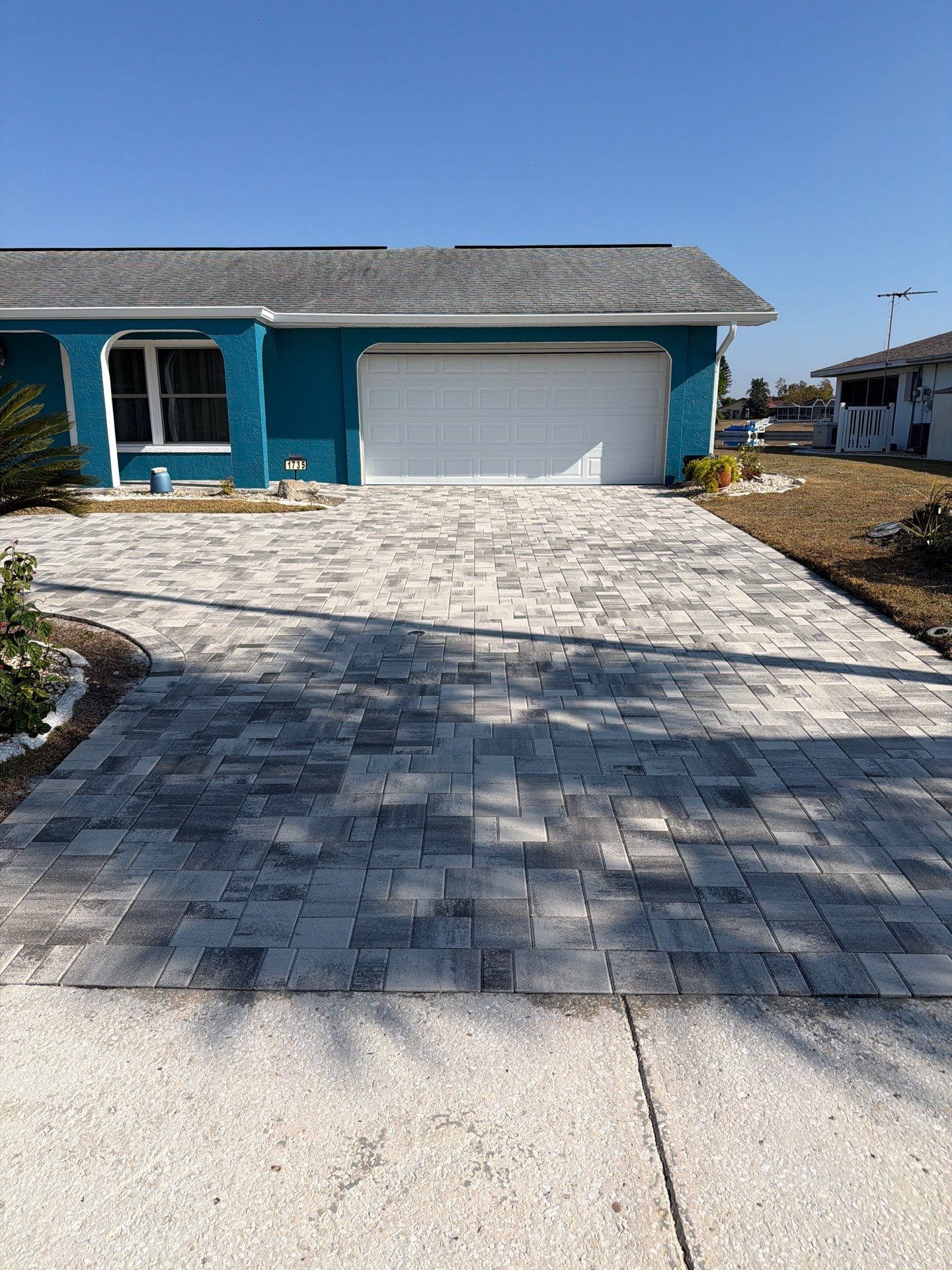 Modern Gray Paver Driveway and Entryway Walkway in Sun City Center by Supreme Paver Experts