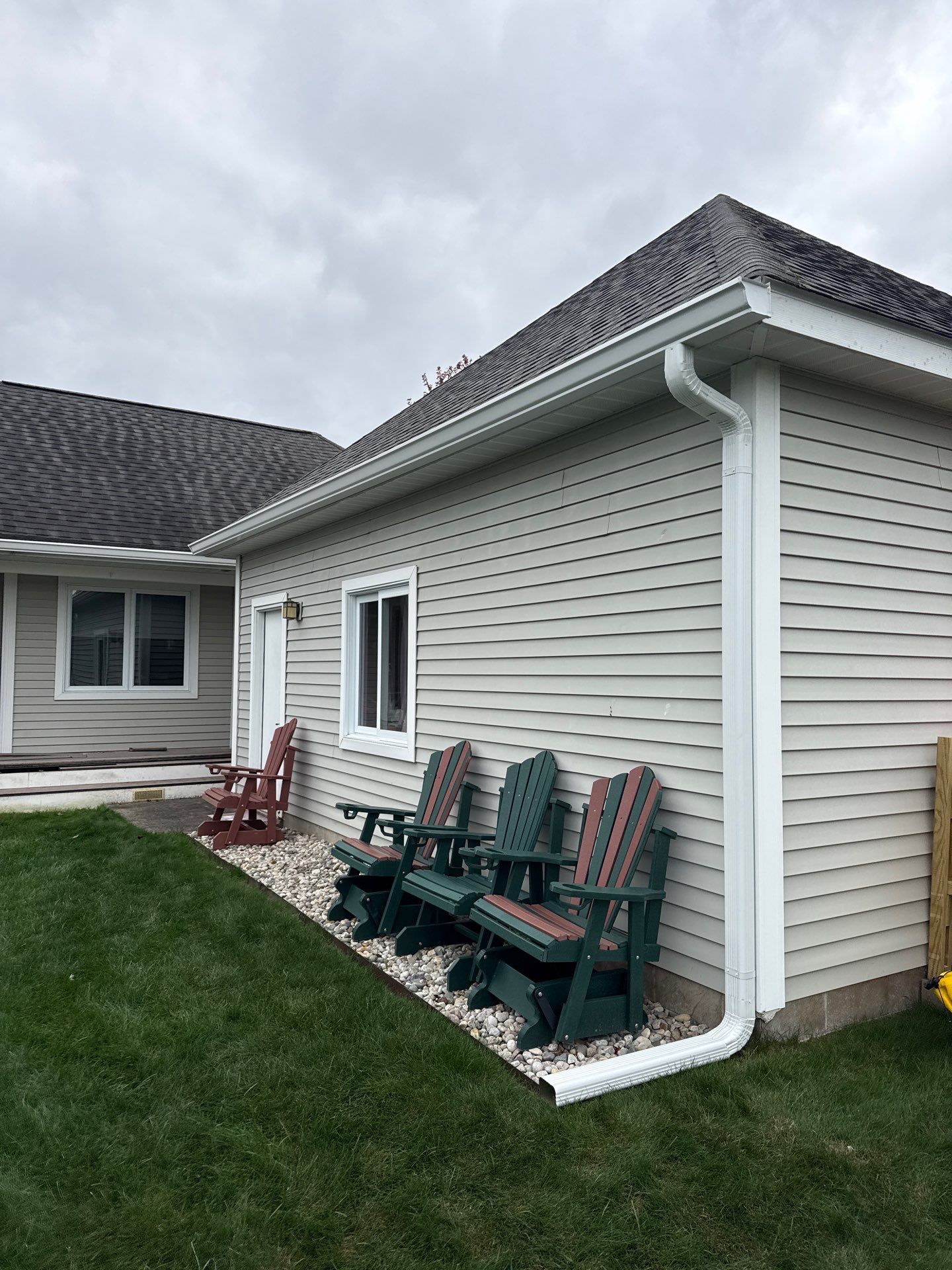 White Gutter System Installation for Traverse City Home by Rainbow Seamless Systems