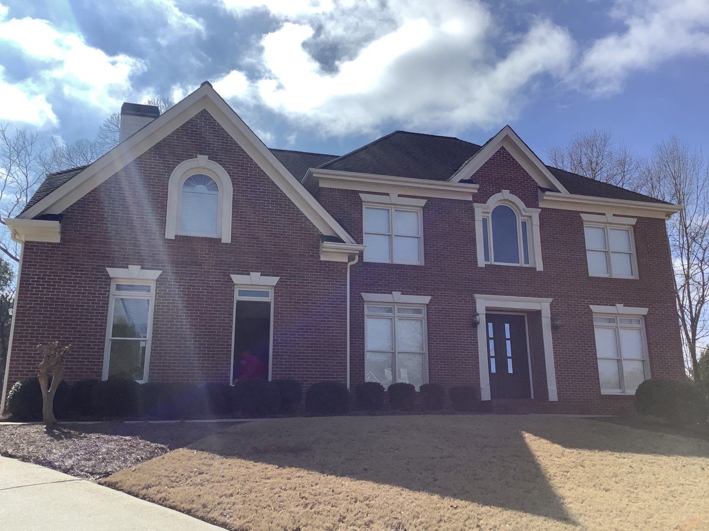 White Brick Exterior Painting and Deck Refinishing in Duluth by Swift Home Renovations