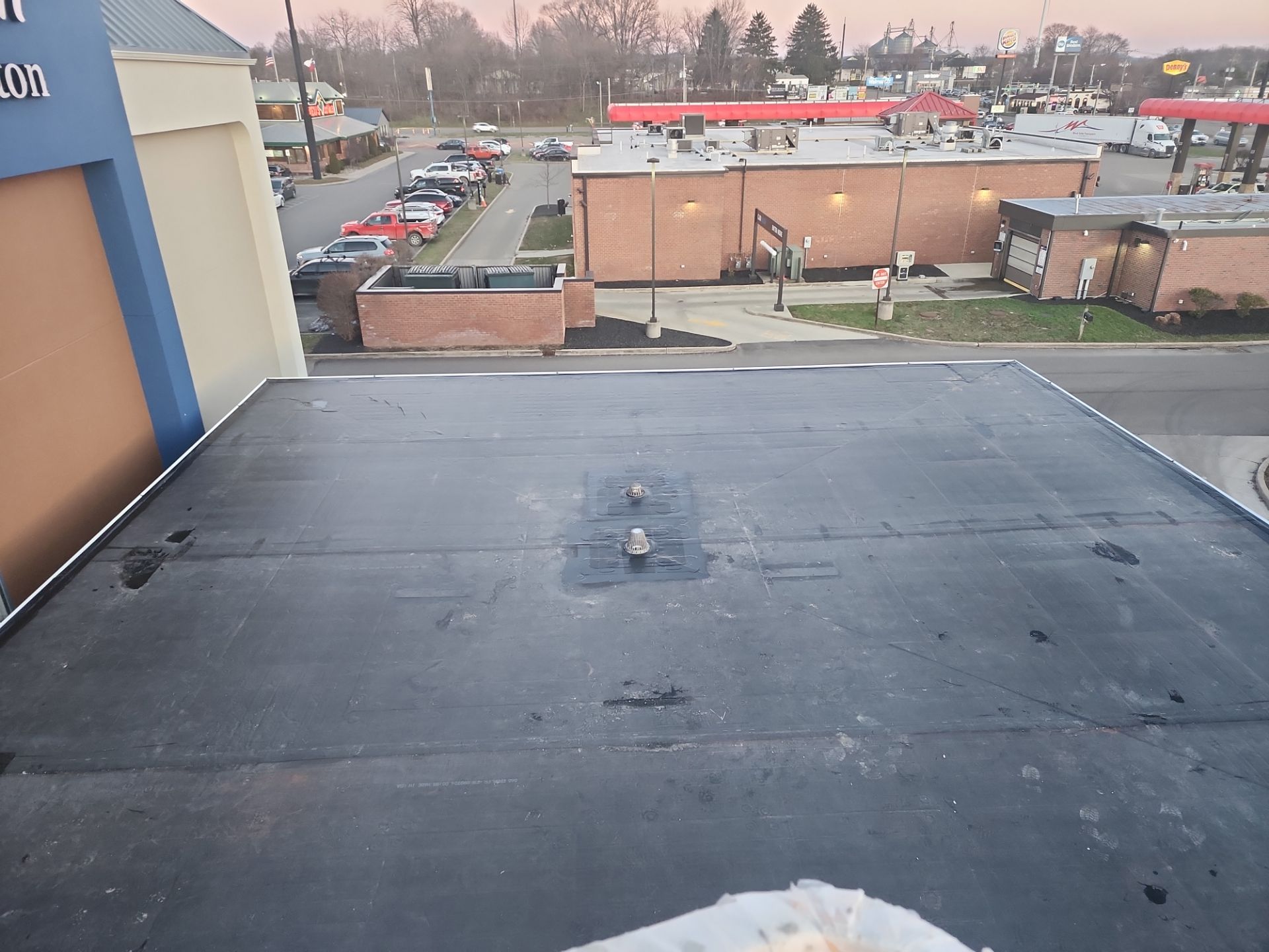 Commercial Roofing Installation using 60 mil rubber roof  by Nitro Roofing and Construction