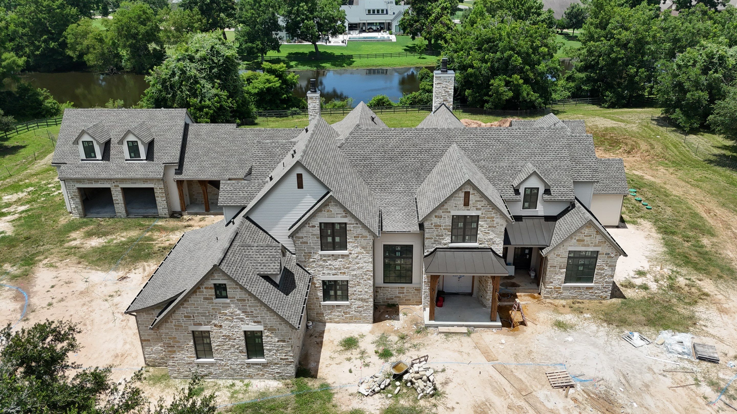 Custom home roof in Fulbrook by Level 7 Companies