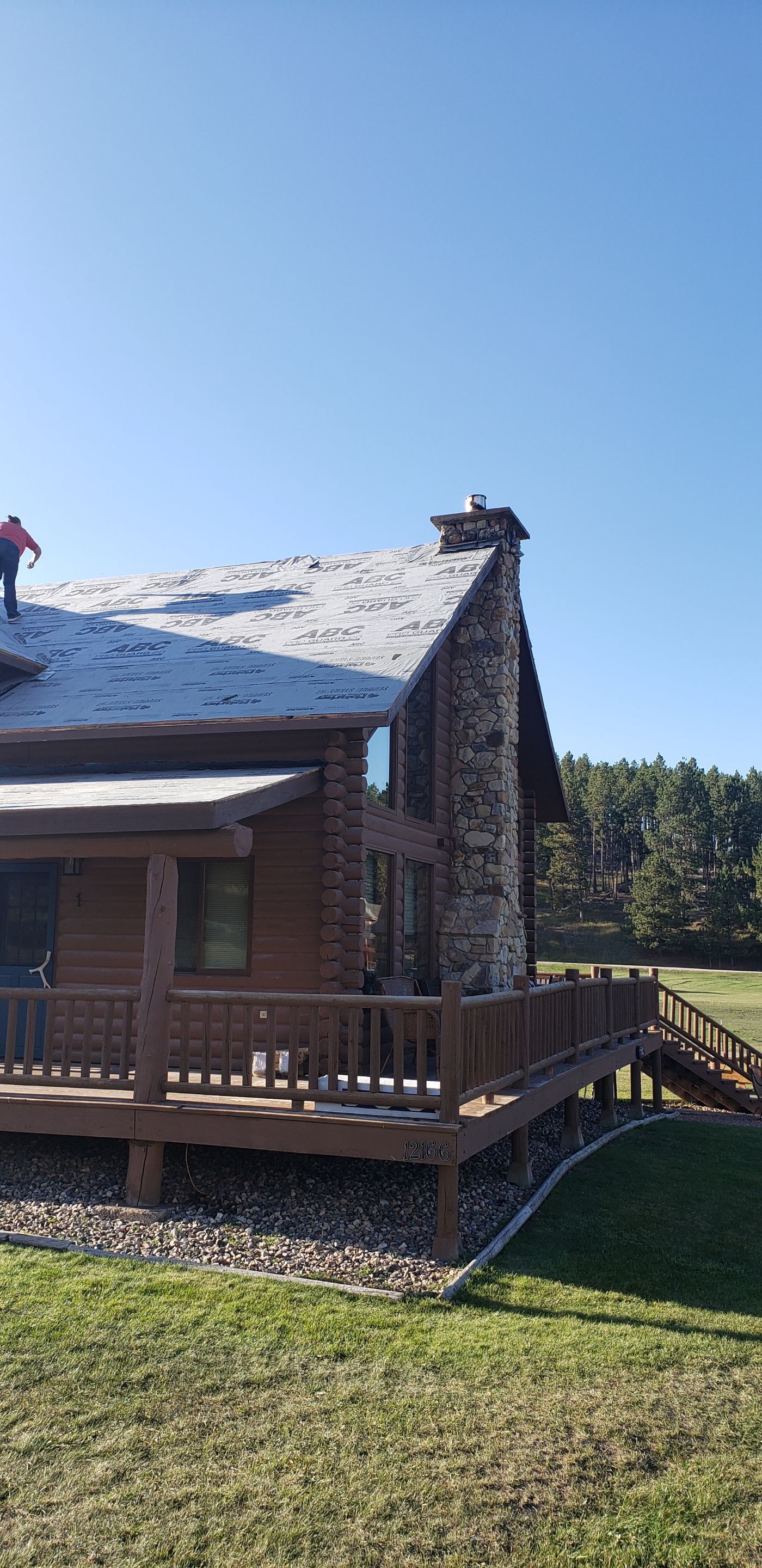 Hill Country Guest Ranch using Steel Roofing, Gutters, Log Cabin Staining by Lightning Exteriors