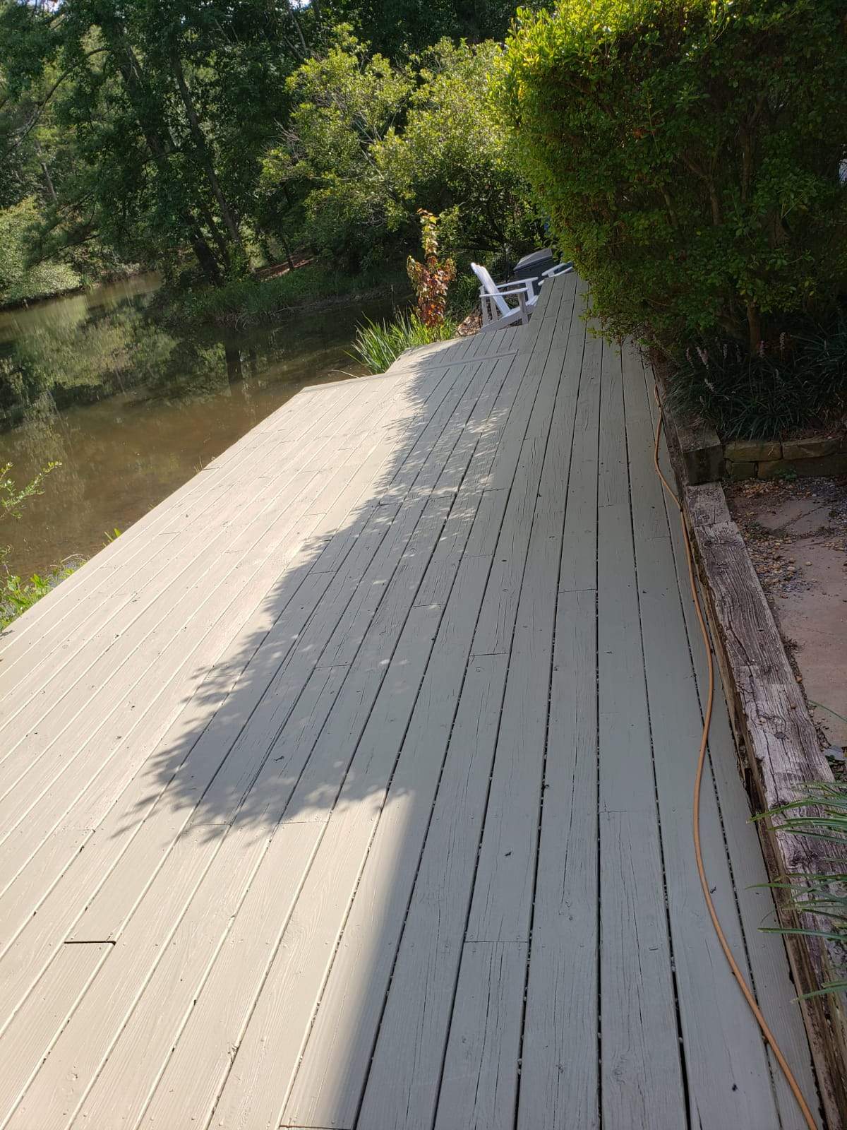 Roswell Deck Restoration Featuring Pressure-Treated Wood and Grey Finish by Swift Home Renovations 