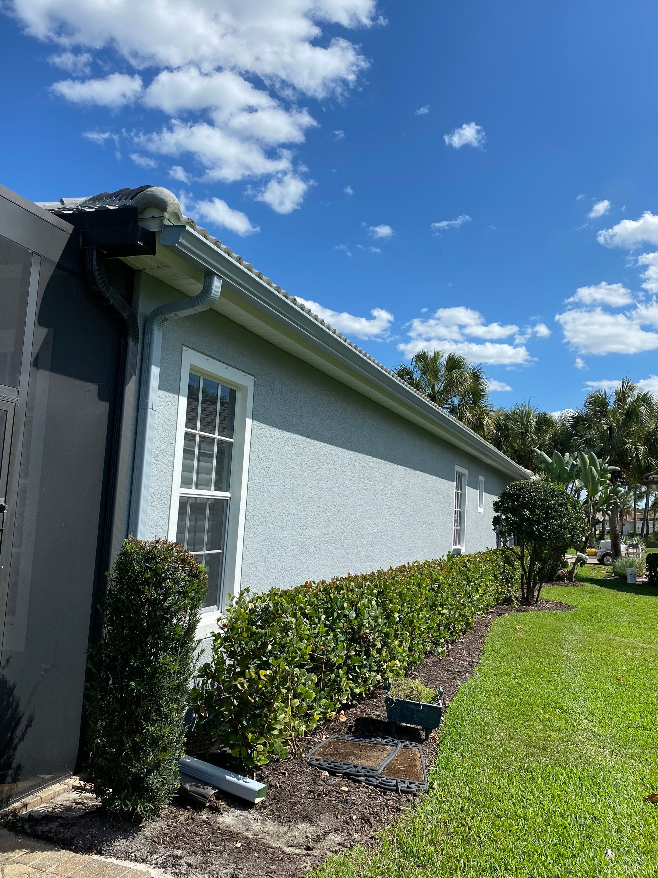 6-inch K-style Seamless Gutters and Splash Guard in Grey Color in Naples FL by Gutter Professors