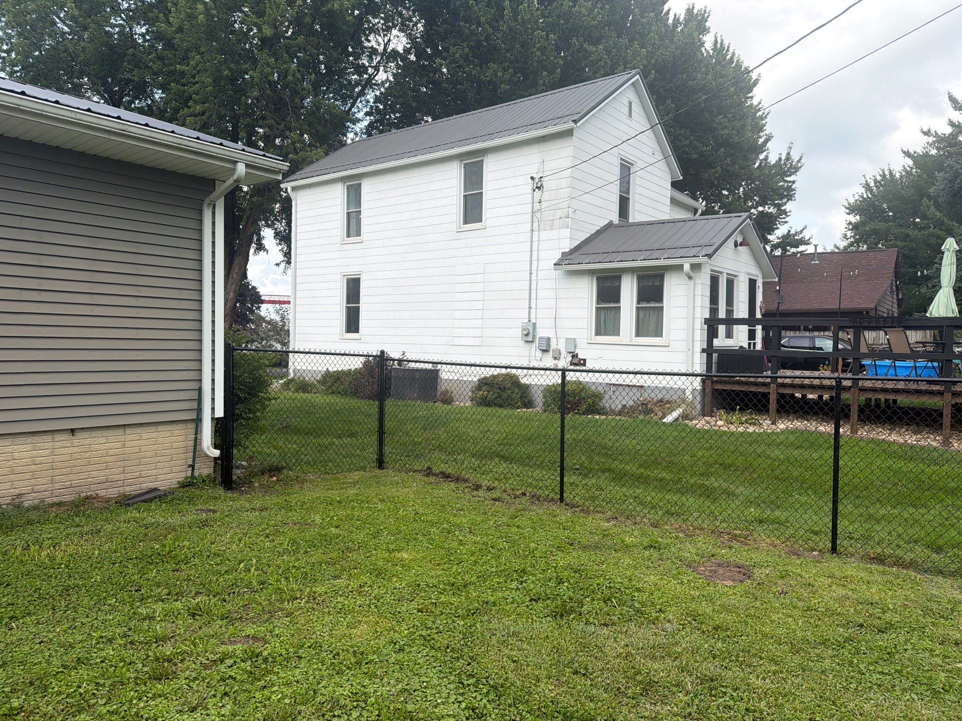 Residential Black Chain Link Fence Installation in Reinbeck by Perfect Picket Fence and Stain