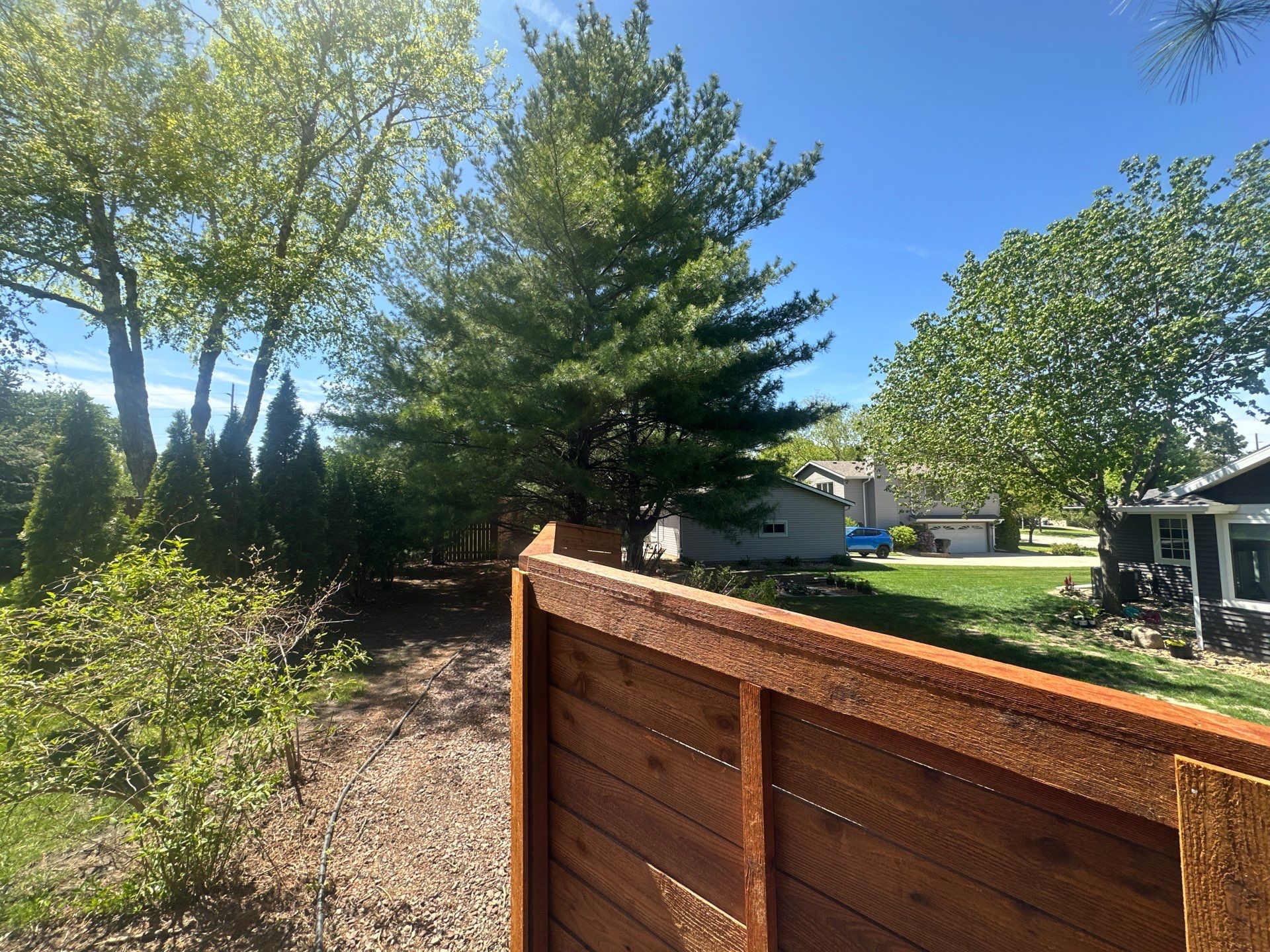 Horizontal Stained Wood Privacy Fence Installation in Waterloo by Perfect Picket Fence and Stain