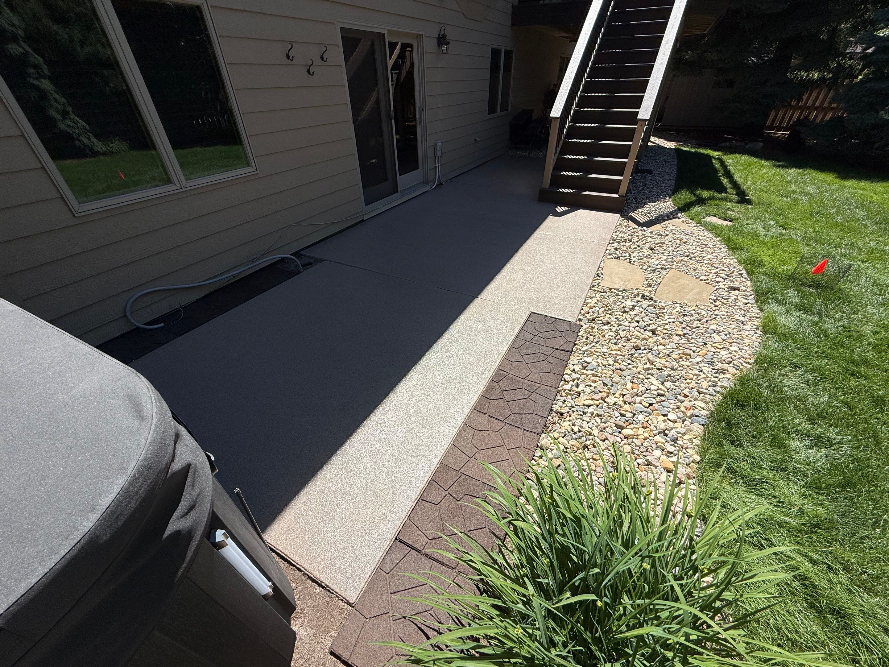 Textured Concrete Coating and Paver Patio Refresh in Sioux Falls by Select Painting, Coatings & Garage Cabinets