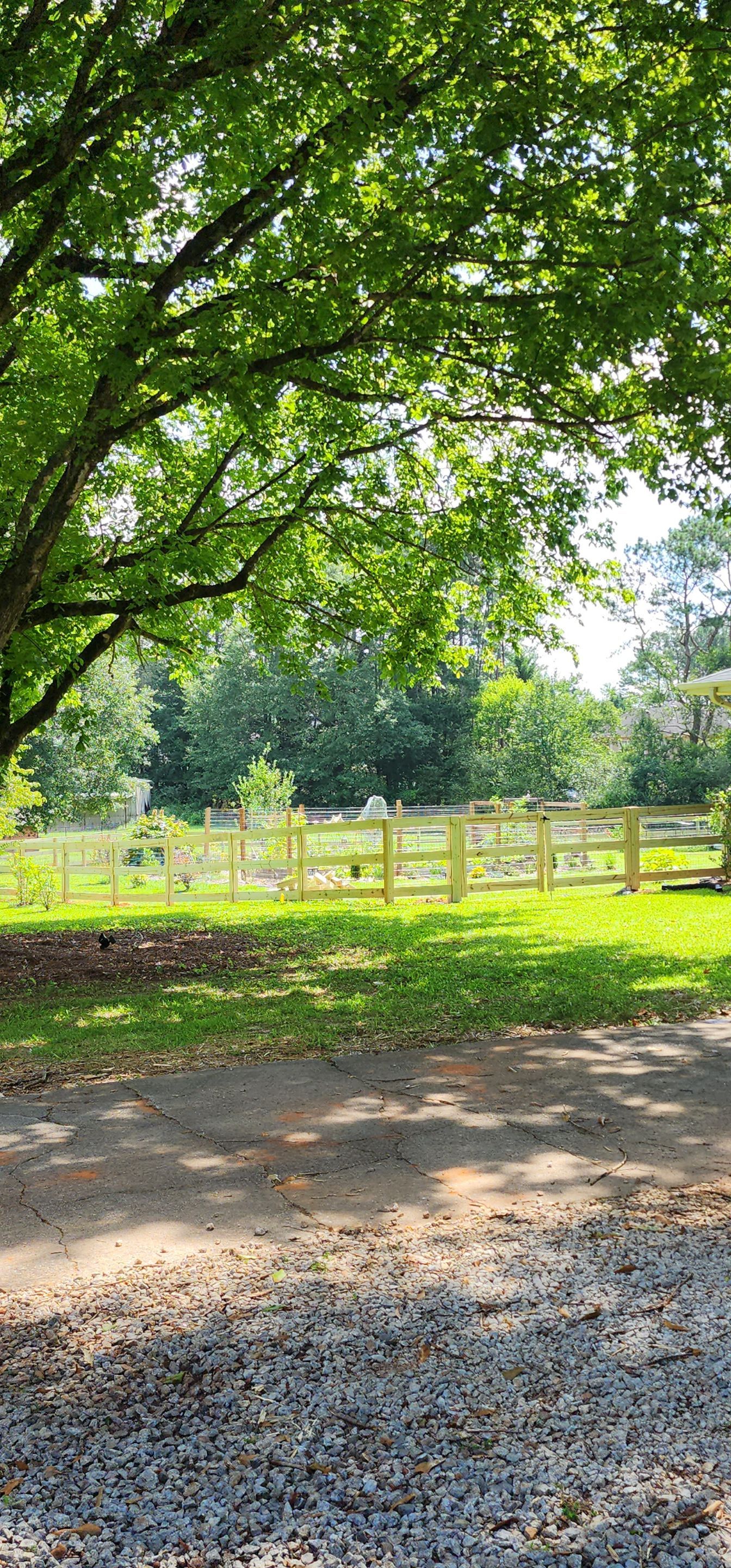 Fence Installation of 3 Rail Ranch with Wire Backing by Titans of Timber Fence & Stain