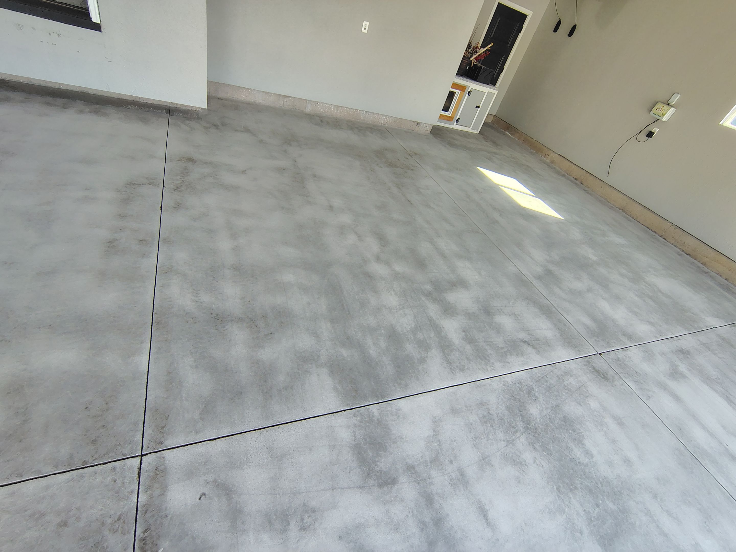 Custom Gray Flake Garage Floor Coating in Sioux Falls by Select Painting, Coatings & Garage Cabinets