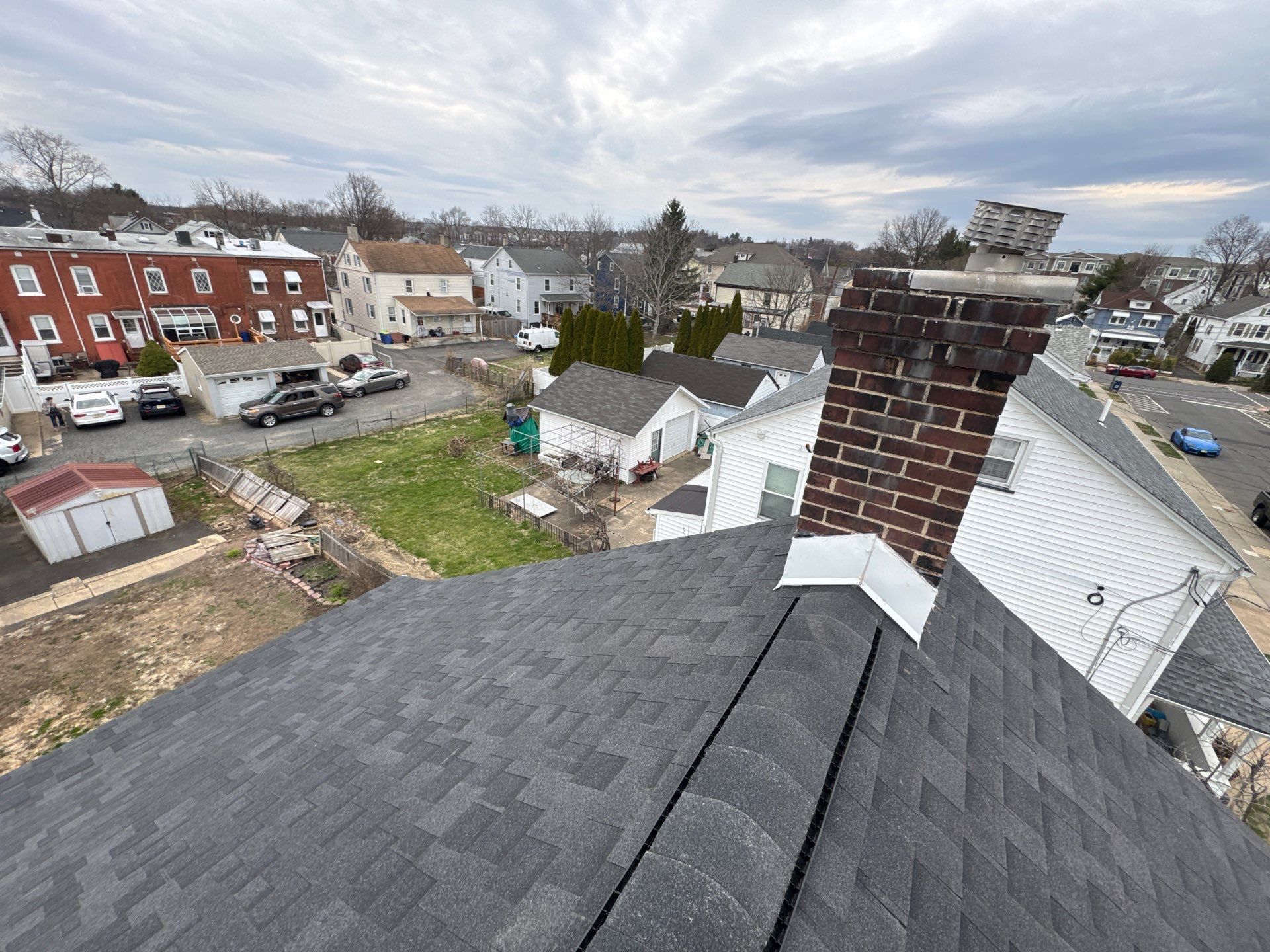 Onyx Black Shingles by Reimagine Roofing