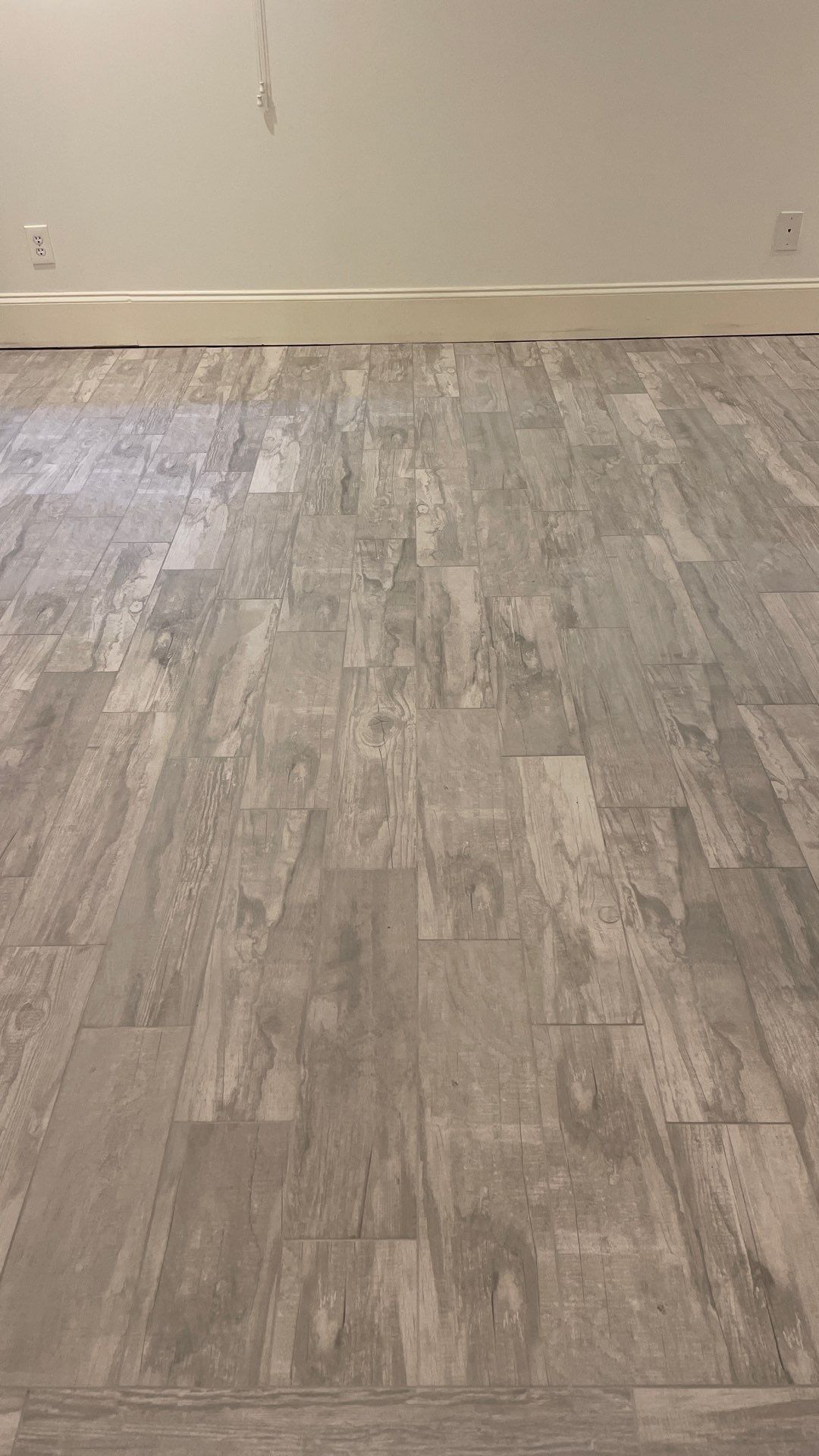 Herringbone and plank tile by Footprints Floors of East Atlanta