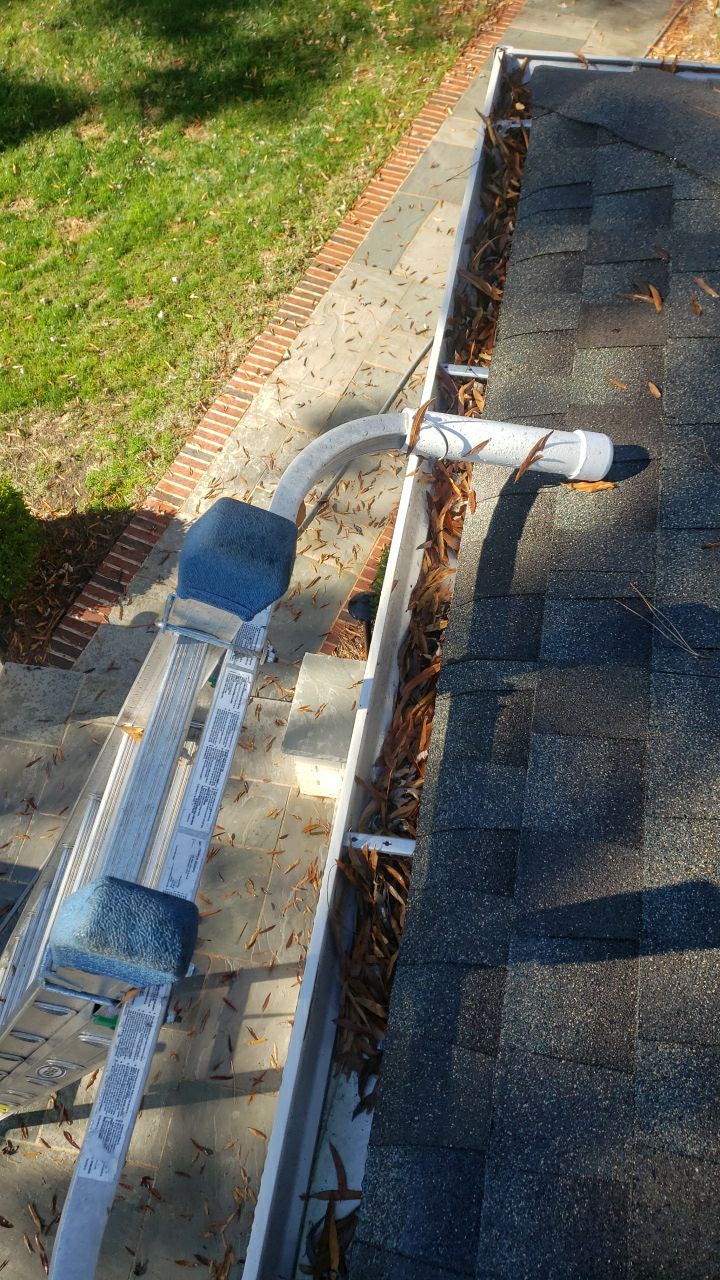 Sara Gutter cleanout using water by G&H Home Tech Pros LLC