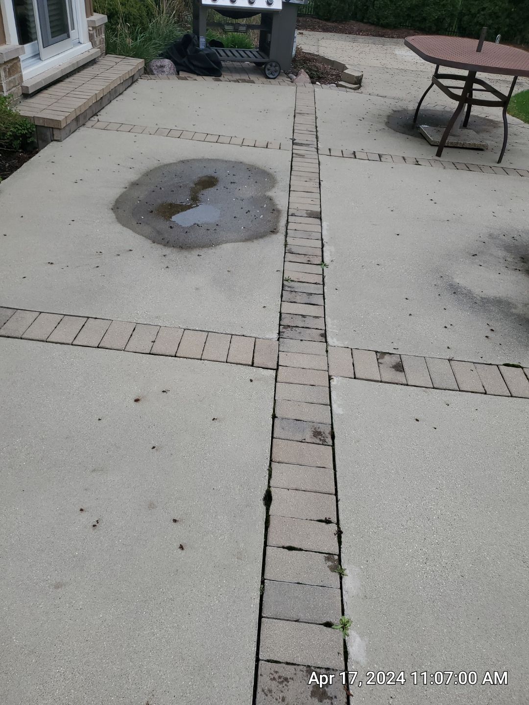 concrete patio and driveway cleaning by Northern Power Washing LLC.