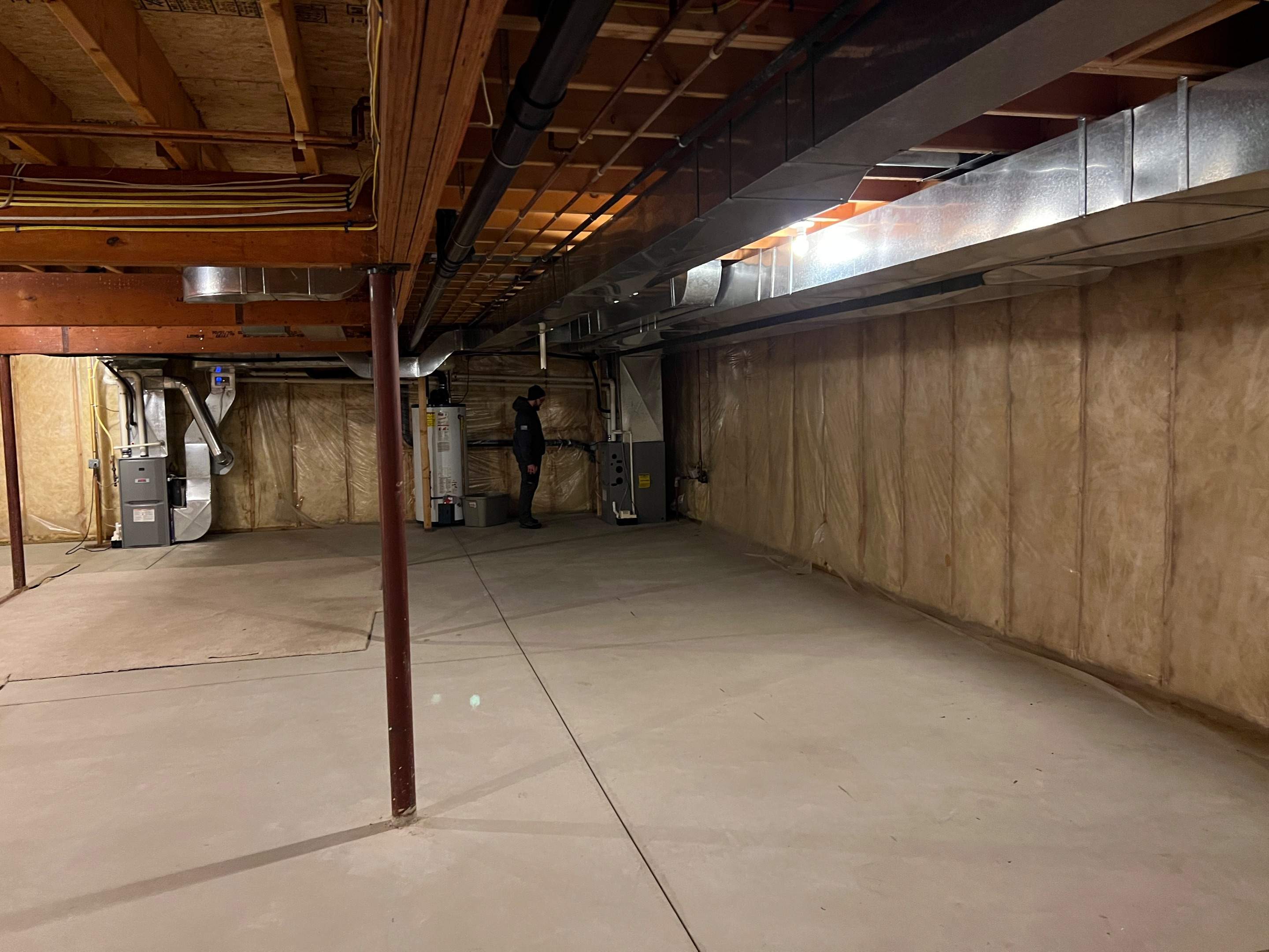 Basement Remodel w/ LVP Flooring & Exposed Ceiling by Chagnon Building & Remodeling LLC