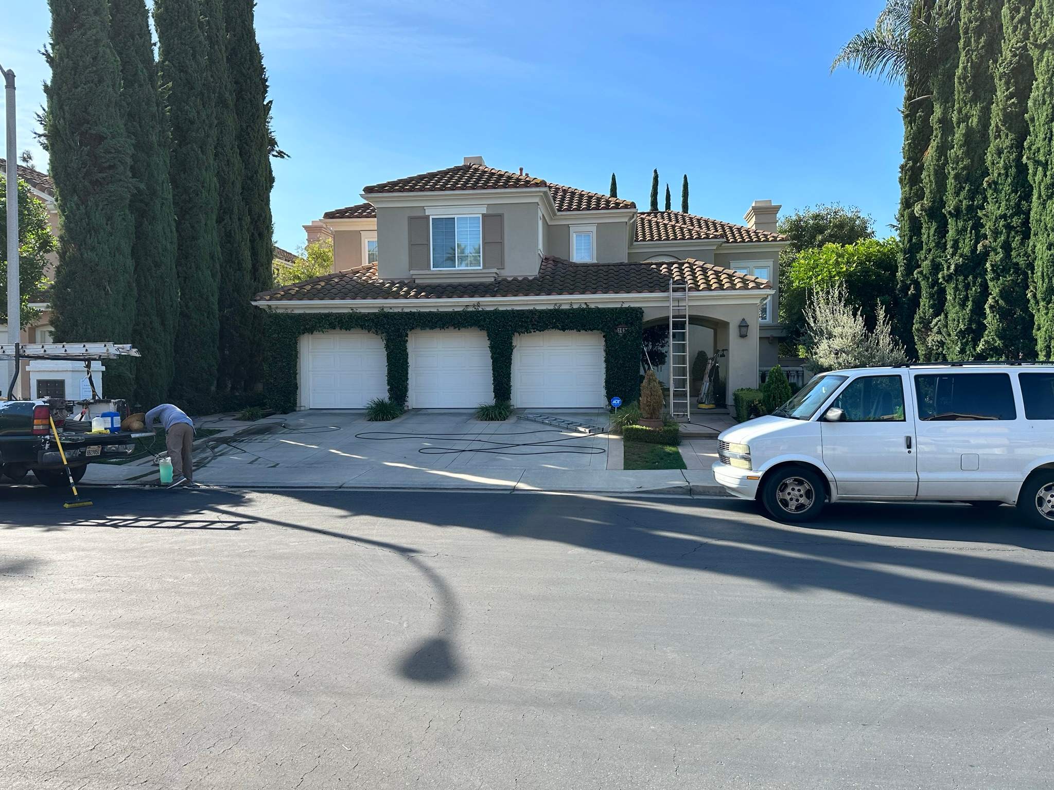 Roof wash on this dirty roof covered in algae by Property Cleaning Experts, LLC