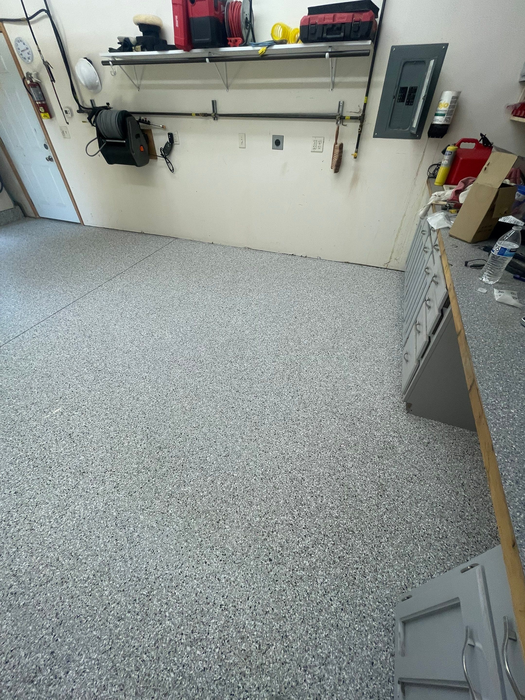 Multi-Stall Garage Floor Coating Installation in Sioux Falls by Select Painting, Coatings & Garage Cabinets