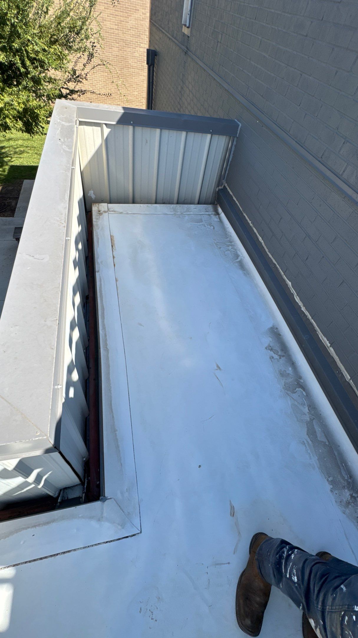Commercial Roofing Repair using TRP #924 Eterna-Sil Premium Silicone Roof Coating by Harvey Roofing & Construction