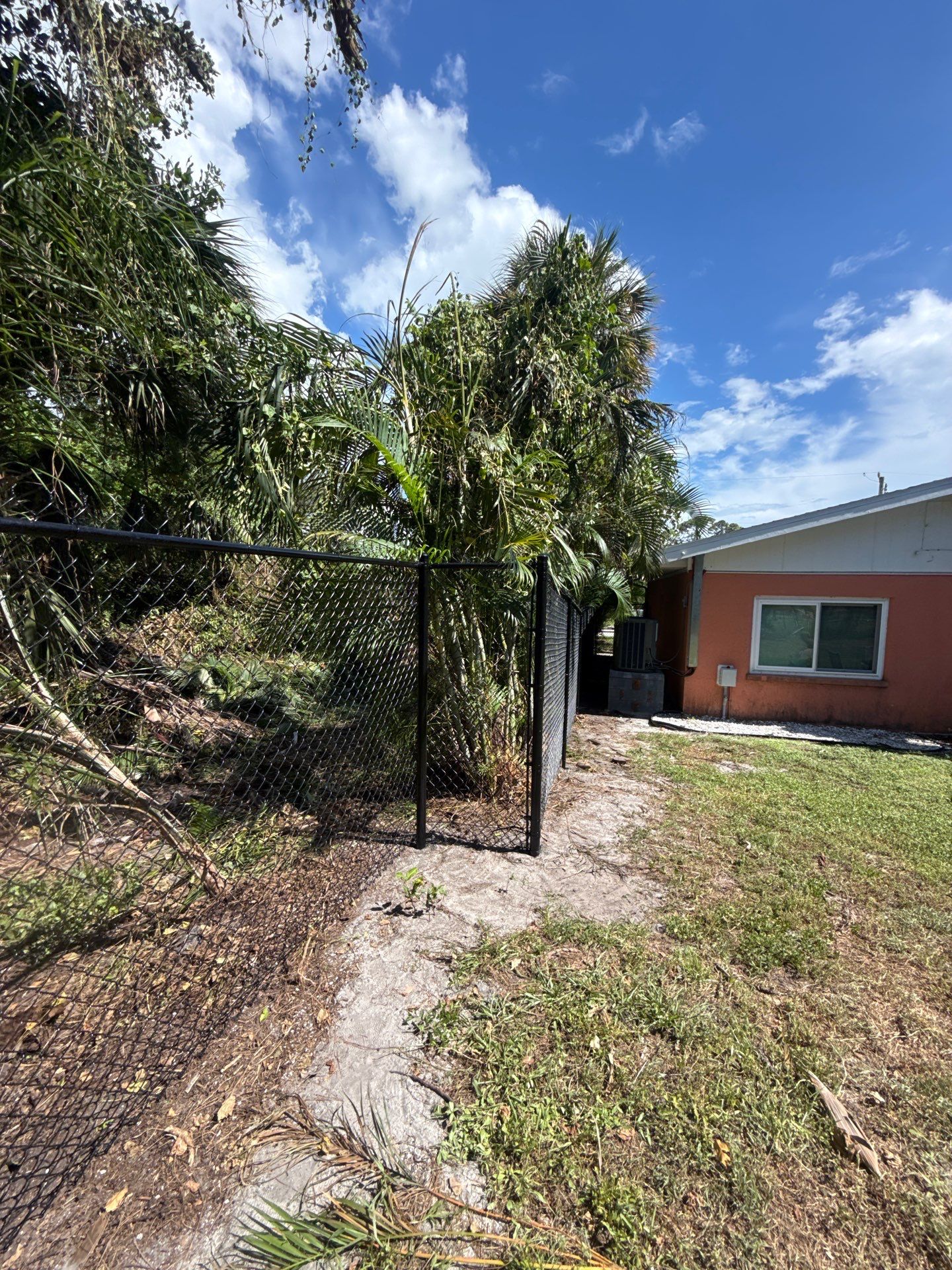 Black Chain Link Fence Installation and Site Clearing in Nokomis by True Fence LLC