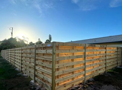 Wood Fence Installation using Horizontal Shadowbox Wood Privacy Fence