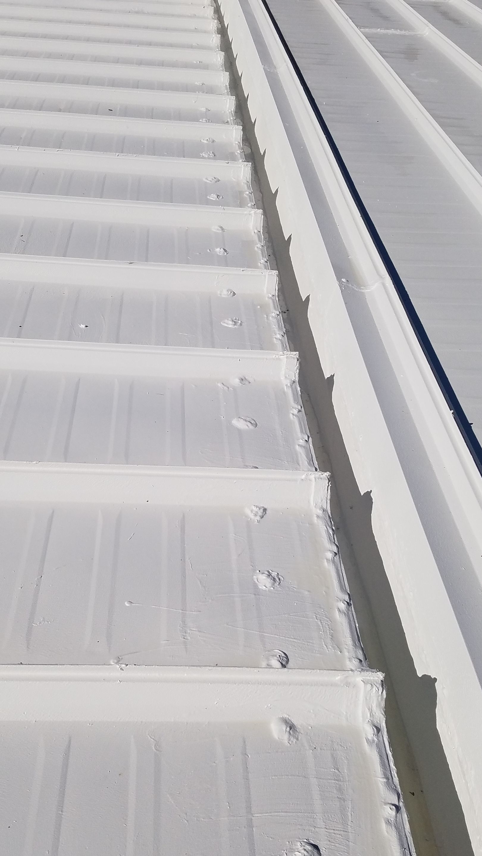 Commercial Metal Roof Coating by Gold Star Roofing LLC