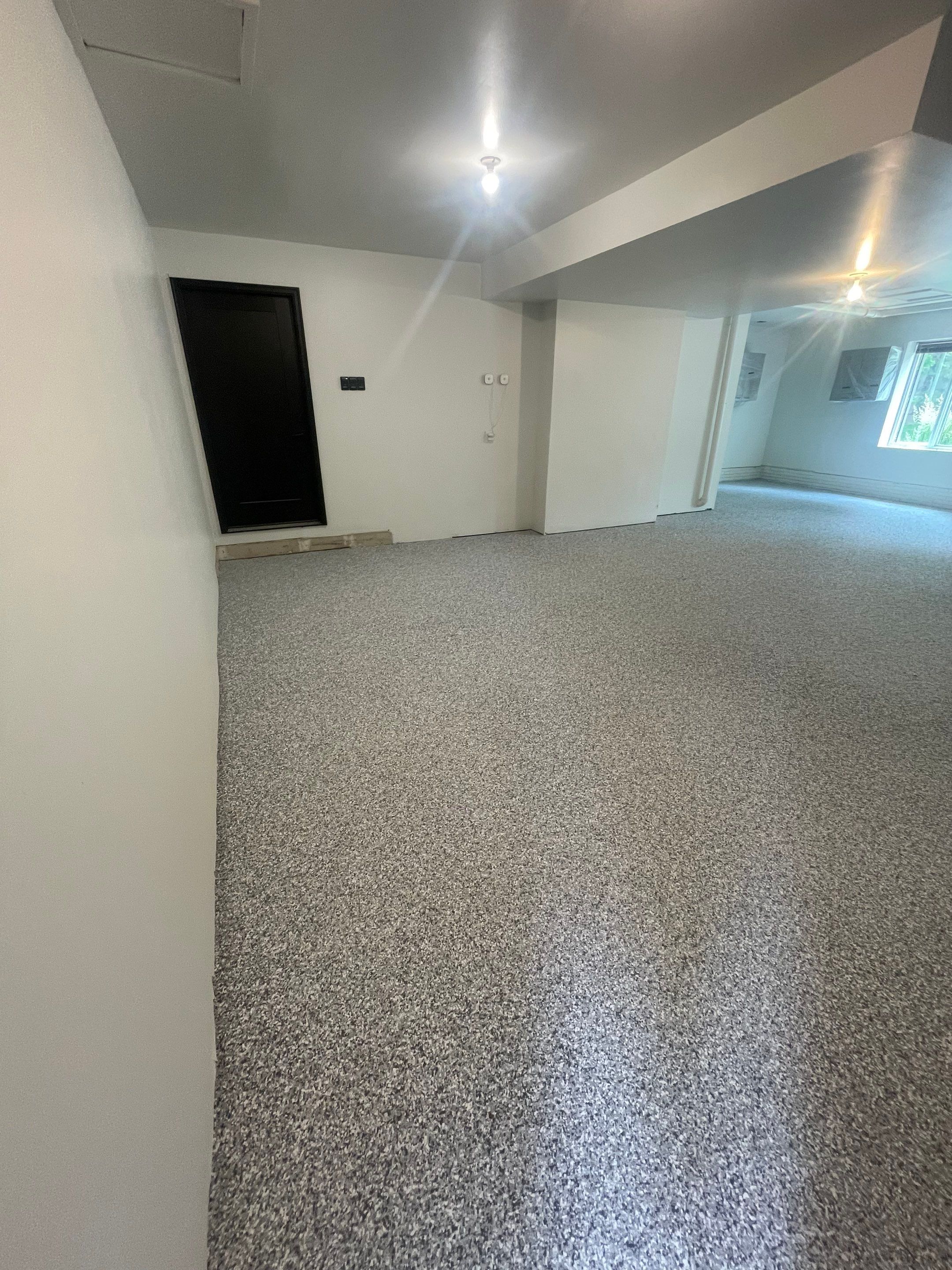 Gray Speckled Epoxy Garage Floor Coating in Sioux Falls by Select Painting, Coatings & Garage Cabinets