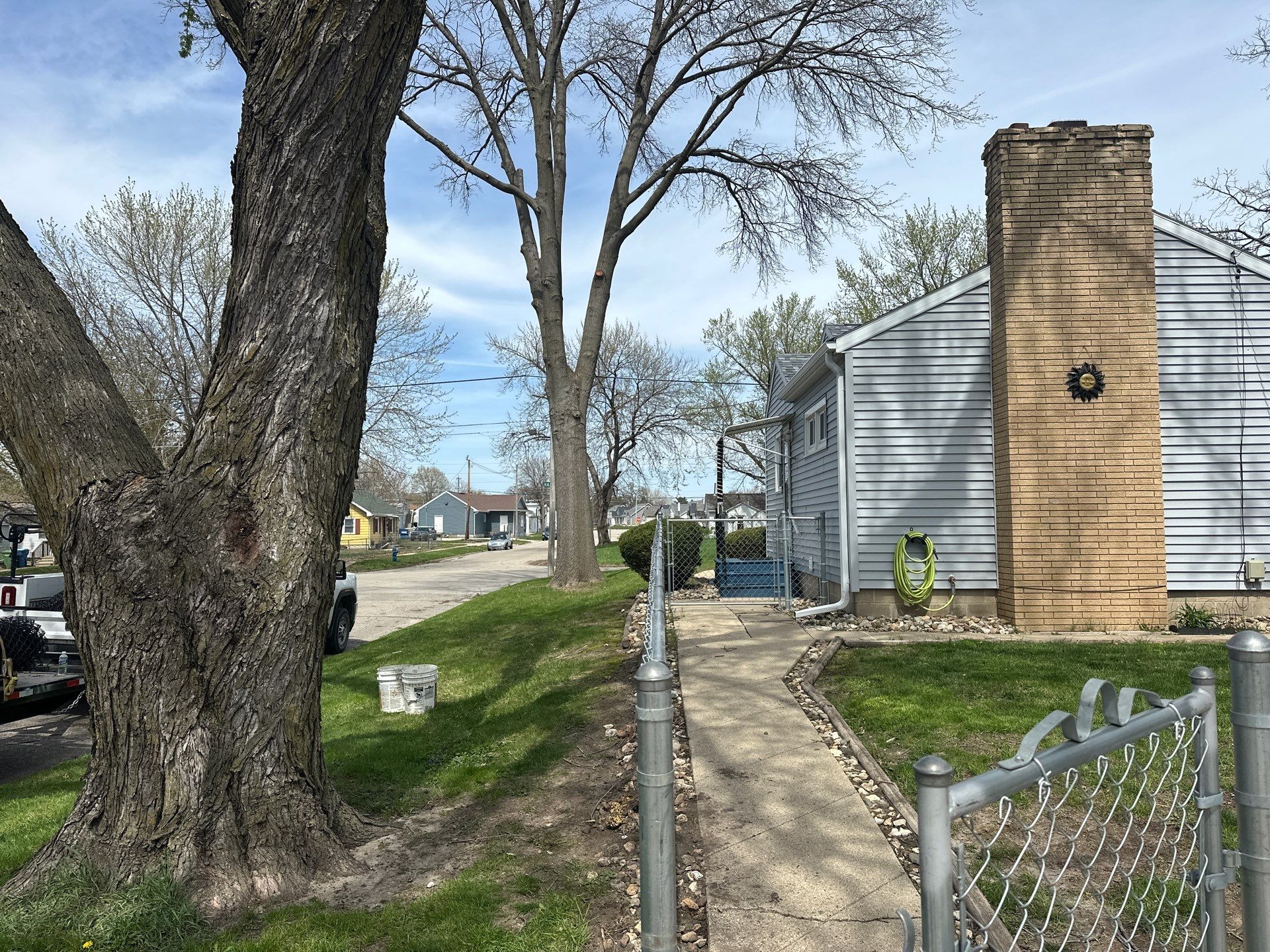 Black Chain Link Fence Installation for Waterloo Residential Backyard by Perfect Picket Fence and Stain