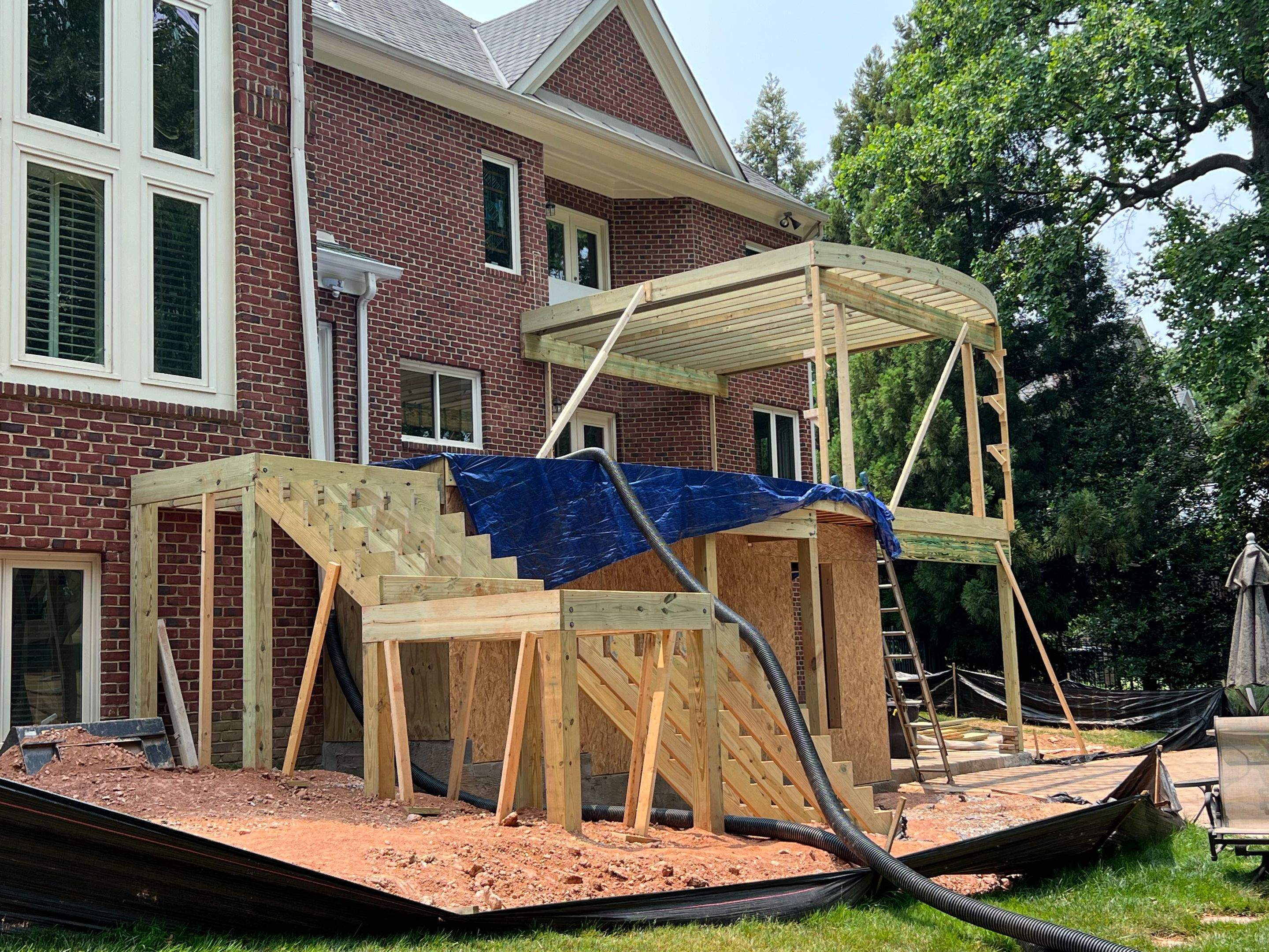 Custom Multi-Level Deck, Outdoor Kitchen & Pool Patio in McLean, VA by Sunburst Construction Inc