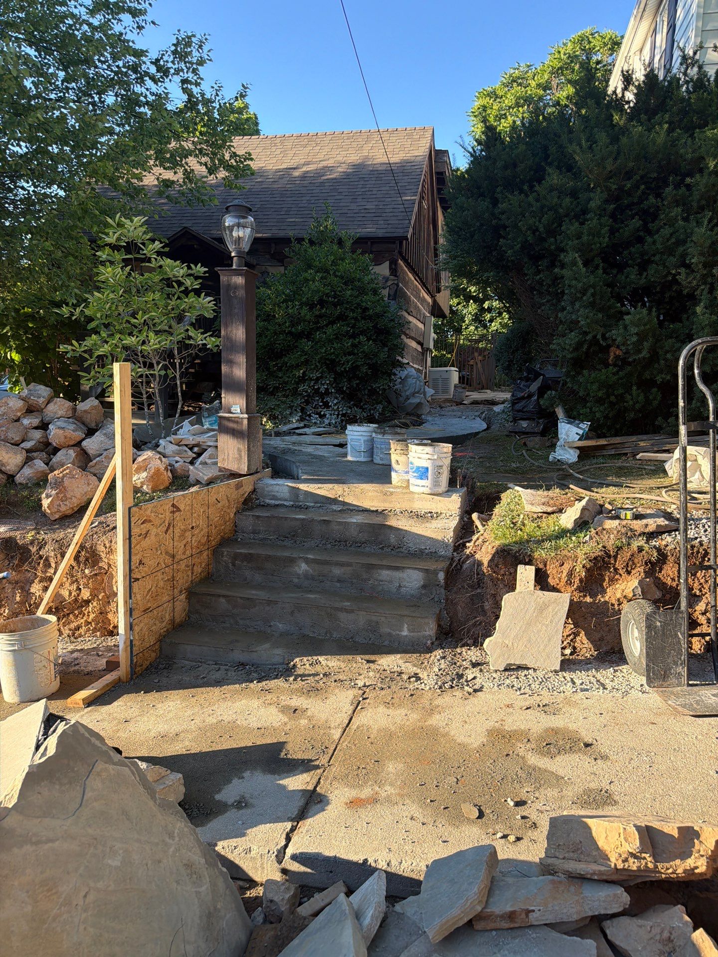 Custom Composite Deck with Stone Fireplace and Modern Cable Railing by Walnut Hollow Decks & Outdoor Living