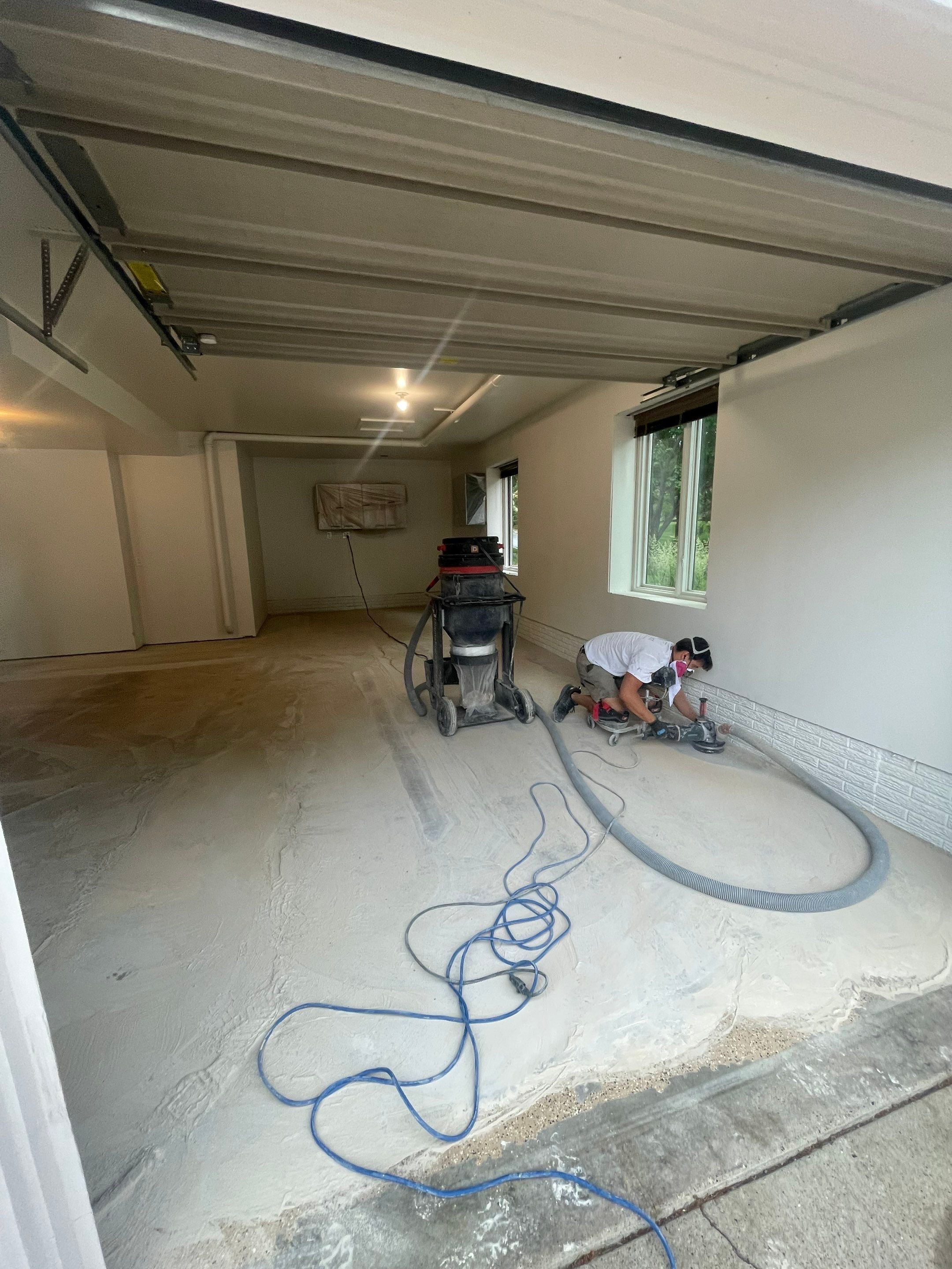 Gray Speckled Epoxy Garage Floor Coating in Sioux Falls by Select Painting, Coatings & Garage Cabinets