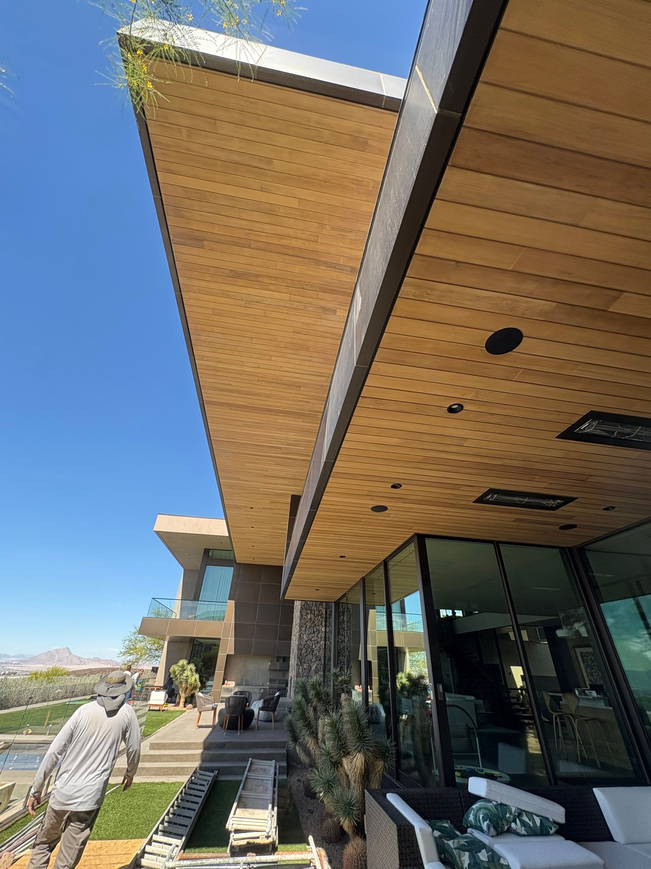 Exterior wood refinish & glass pool enclosure by Level Builders