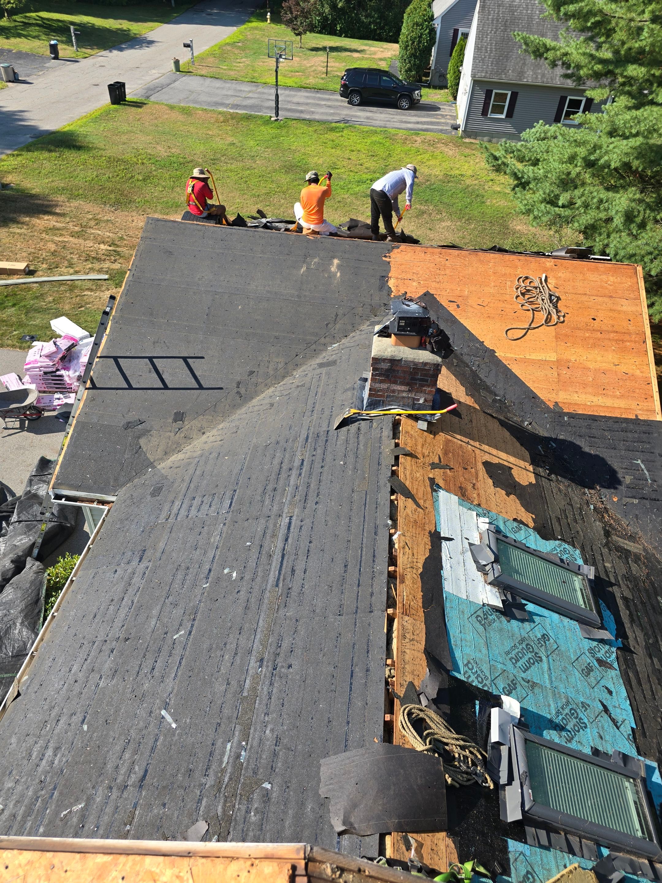 Complete Roof Replacement with Chimney Flashing, Gutter Guard System, and Vinyl Siding Repairs by Mighty Dog Roofing of Greater Middlesex County