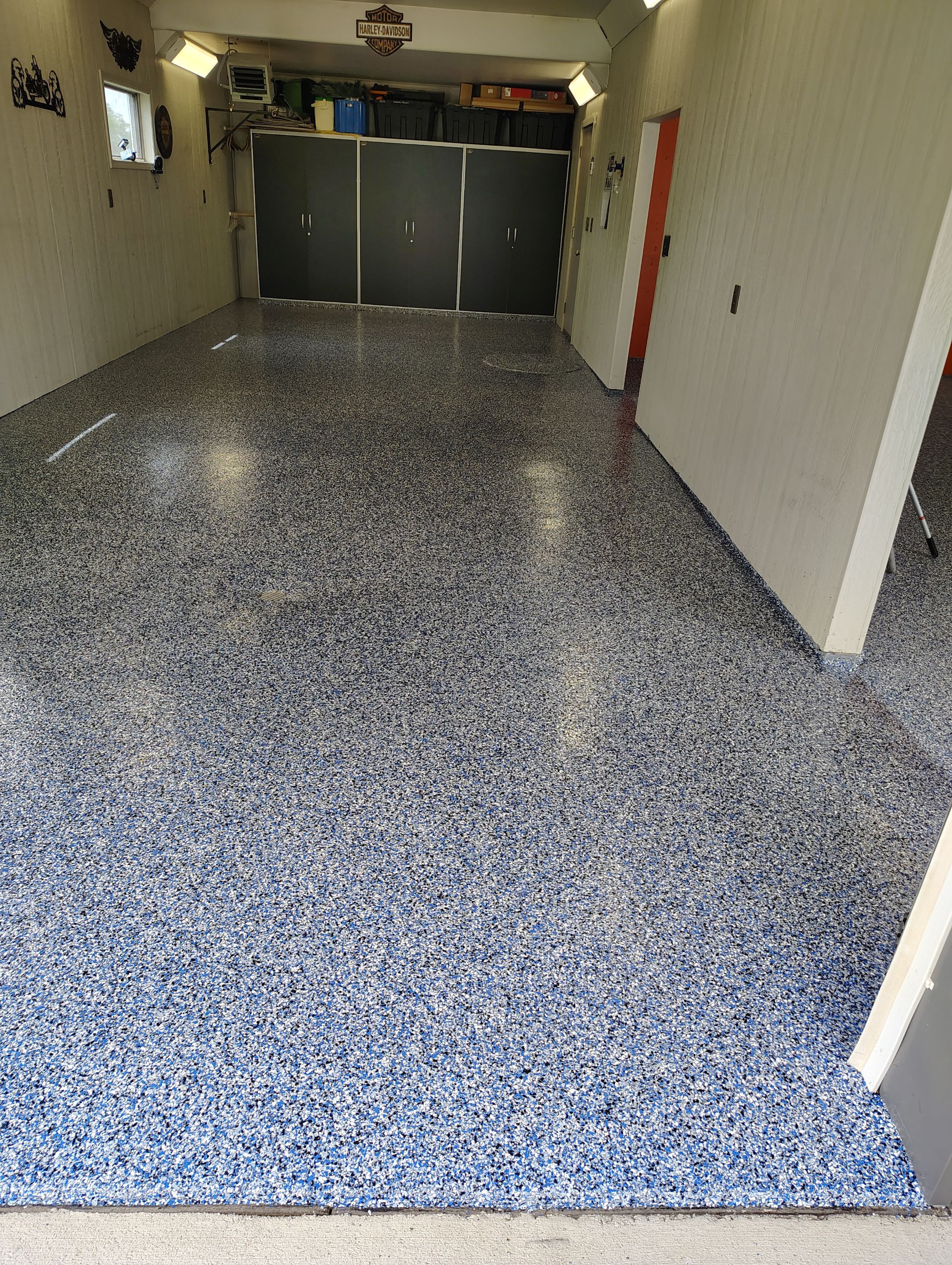 Custom Grey Flake Epoxy Garage Floor Installation in Remsen by Select Painting, Coatings & Garage Cabinets