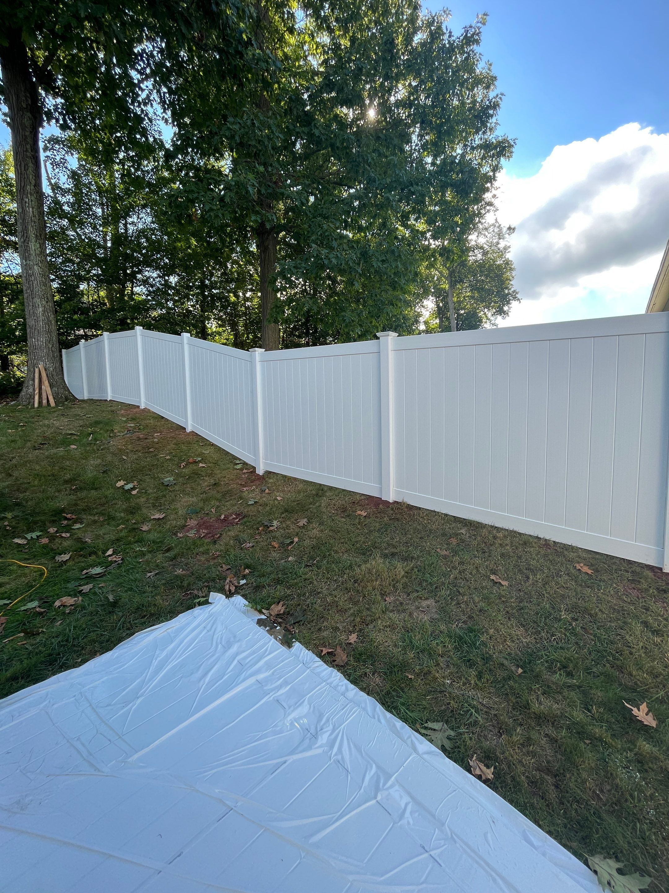 New Vinyl Privacy fence in White with matching gate by DiGiorgi Roofing and Siding Inc