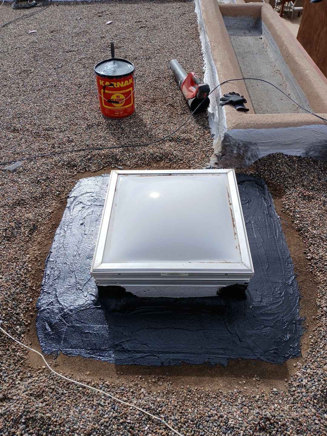 Roof Maintenance and Low-E Tempered Glass Skylight Replacement on Gravel Roof in Northwest Albuquerque by Doyle Roof Masters Inc