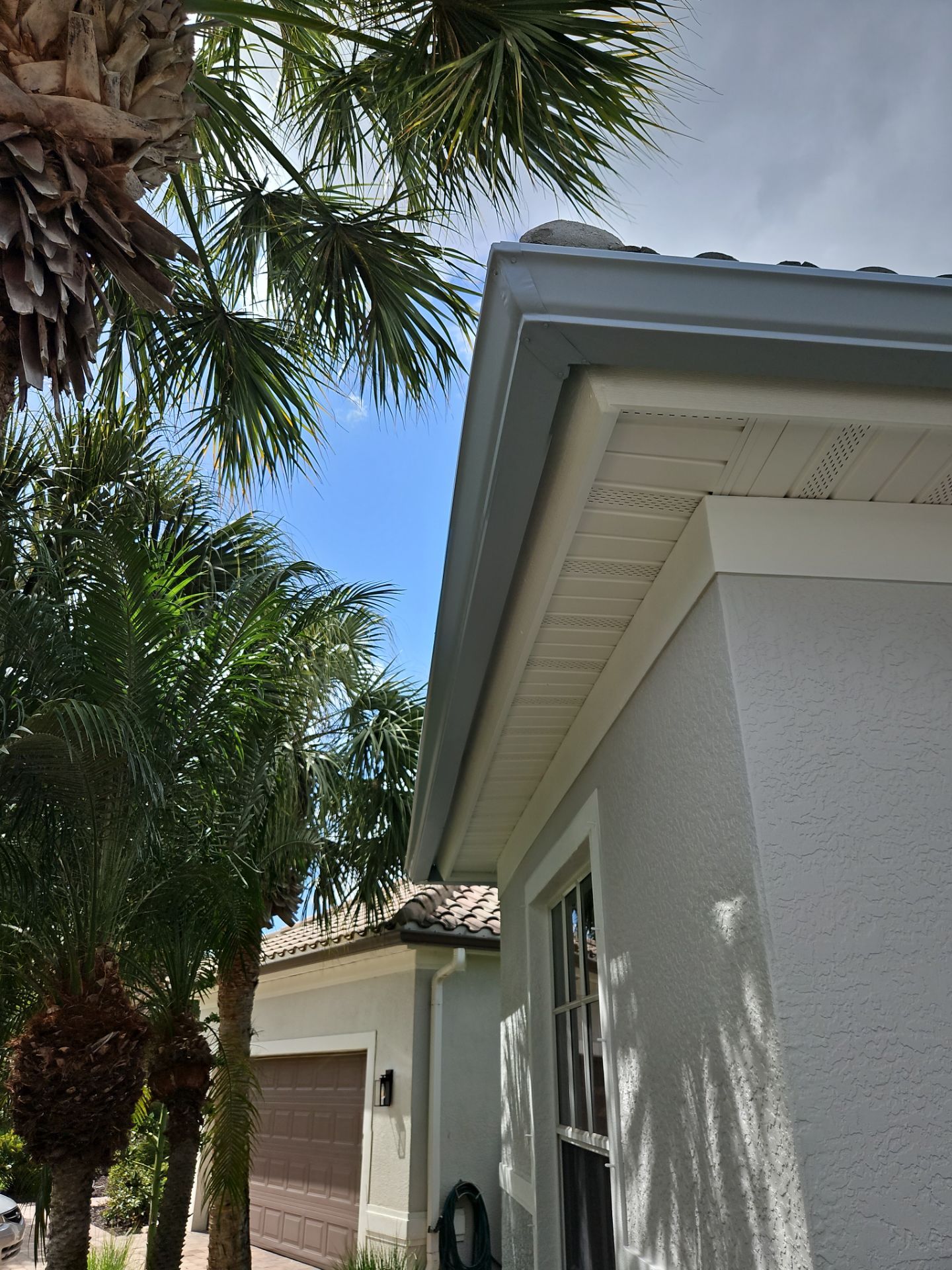 6-inch K-style Seamless Gutters and Splash Guard in Grey Color in Naples FL by Gutter Professors