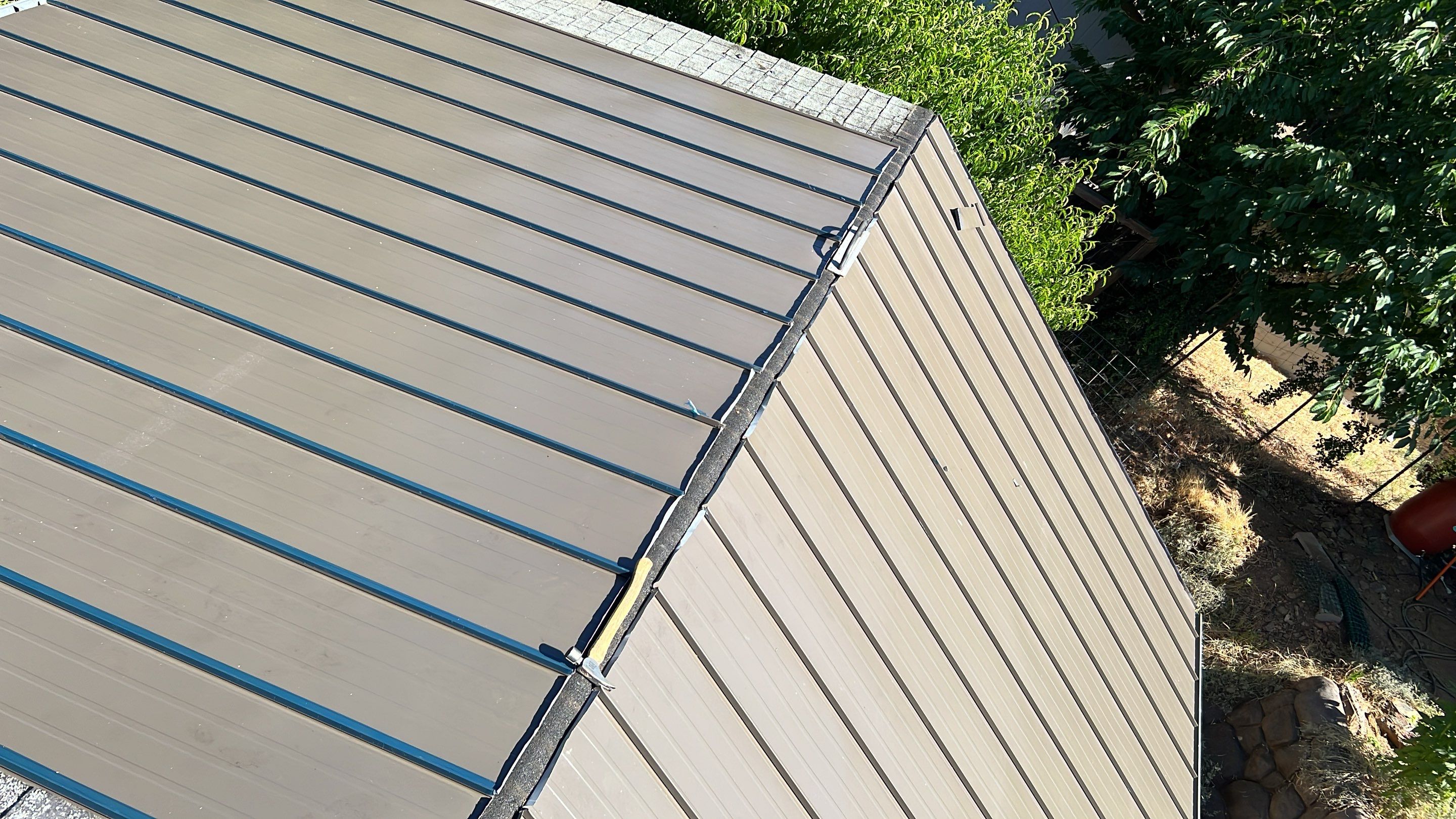 Metal roofing installation using ASC Standing Seam metal by Straight Edge Roofing Inc