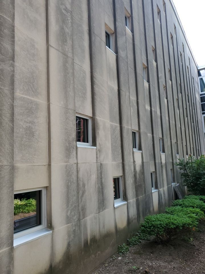 Courtyard pressure washing difficult access.  by Northern Power Washing LLC.