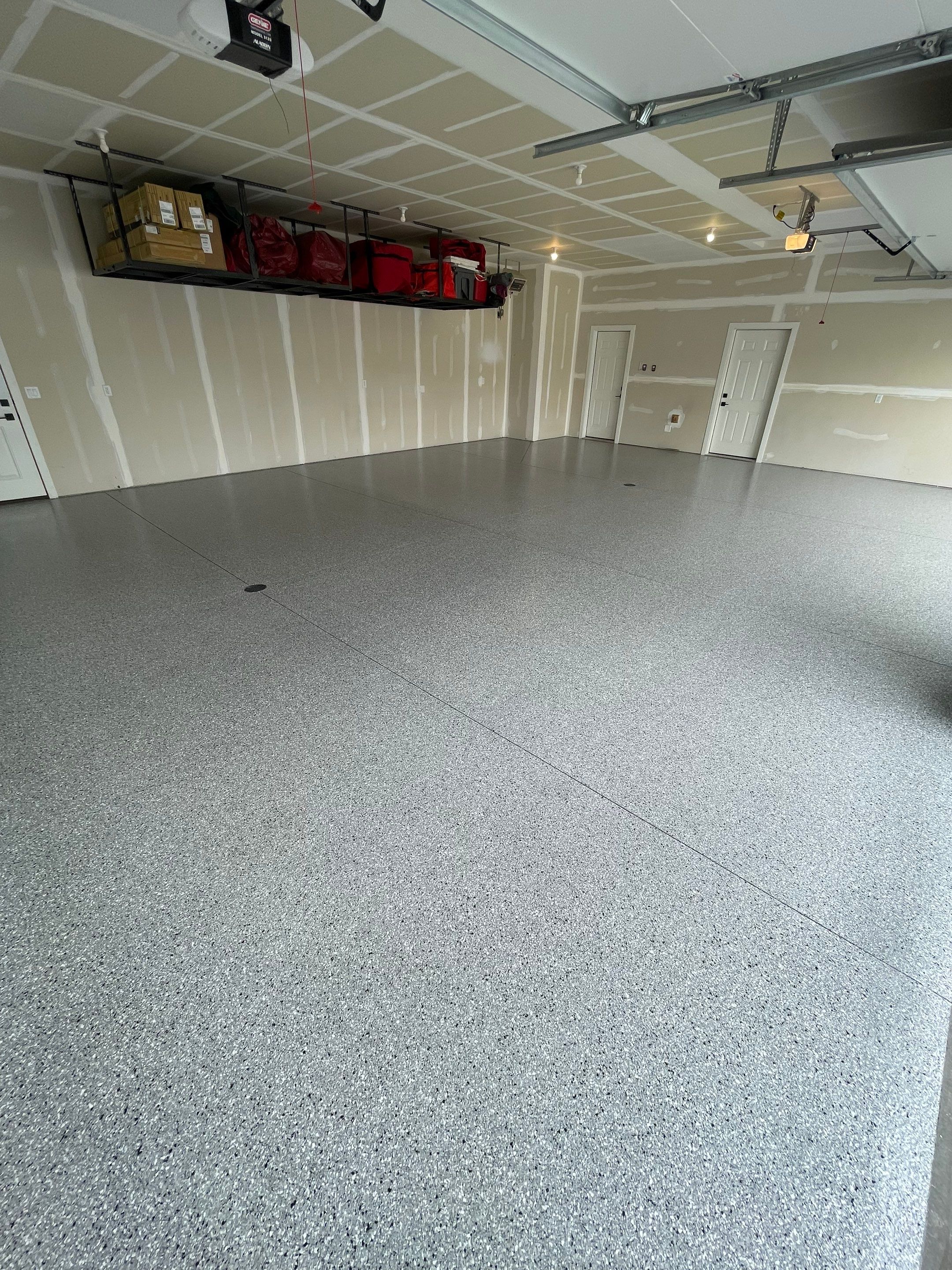 Grey Speckled Epoxy Floor Coating for Sioux Falls Garage by Select Painting, Coatings & Garage Cabinets
