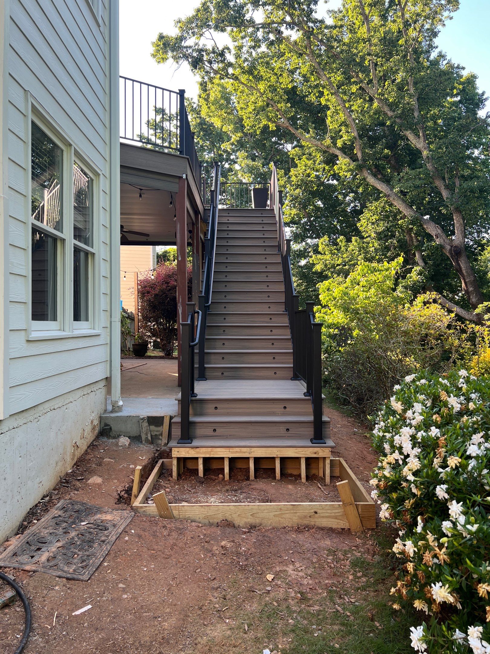 Elevated Composite Deck and Concrete Landing Installation in Kennesaw by Swift Home Renovations