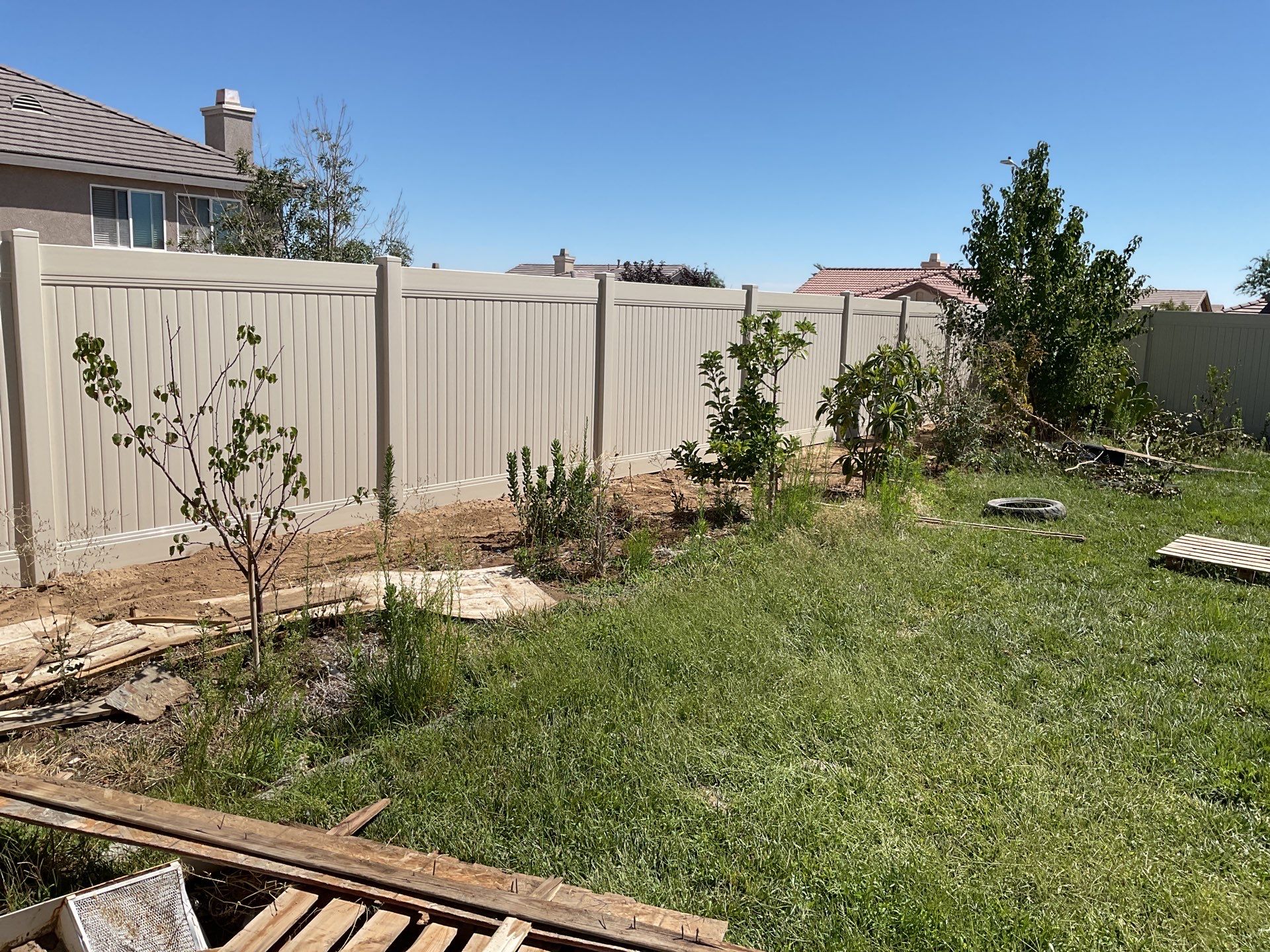 Tan Vinyl by Fence Guys Inc. 