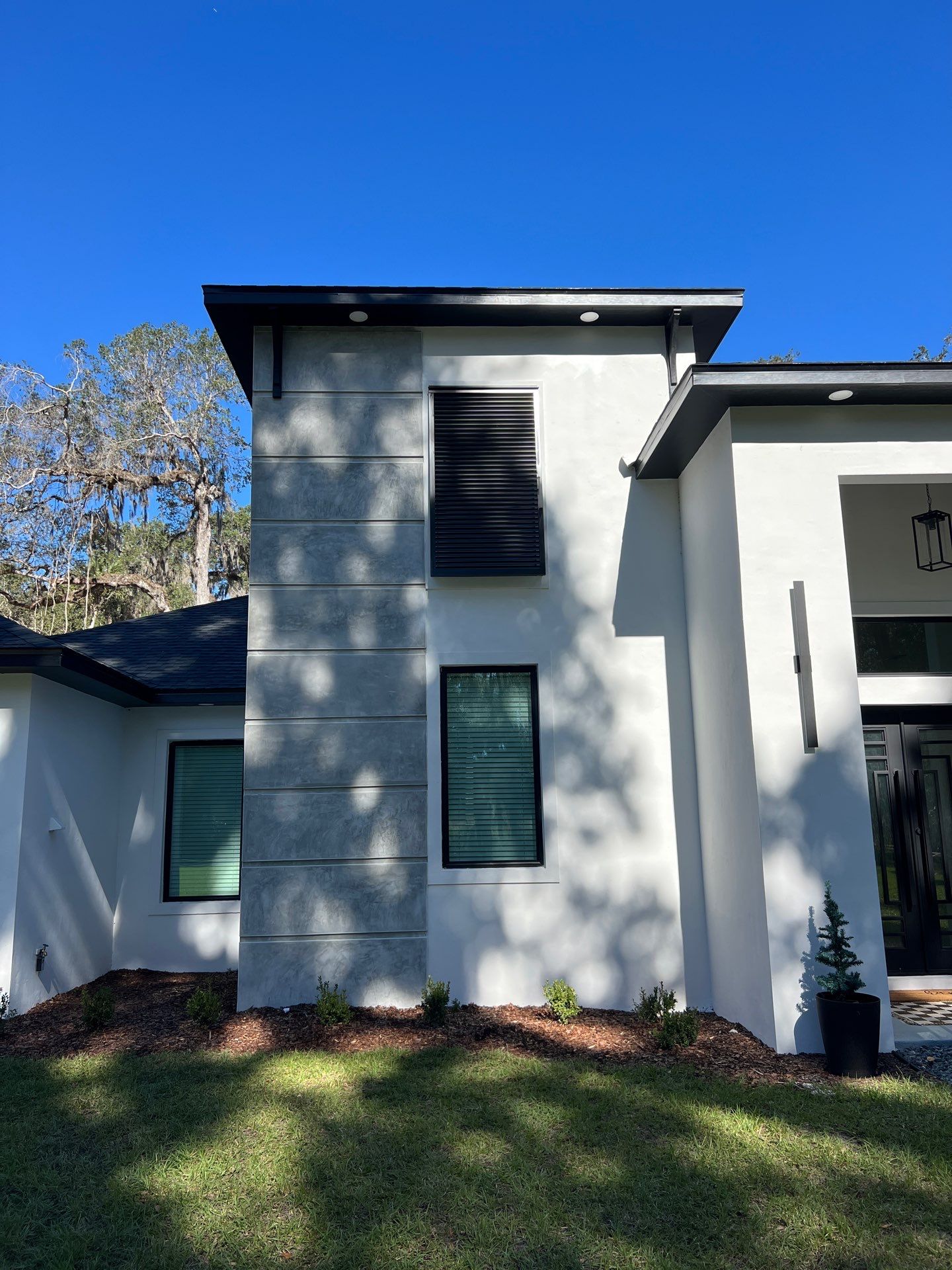 Bahama Shutters in Signal Black  by Smart Guard Shutters