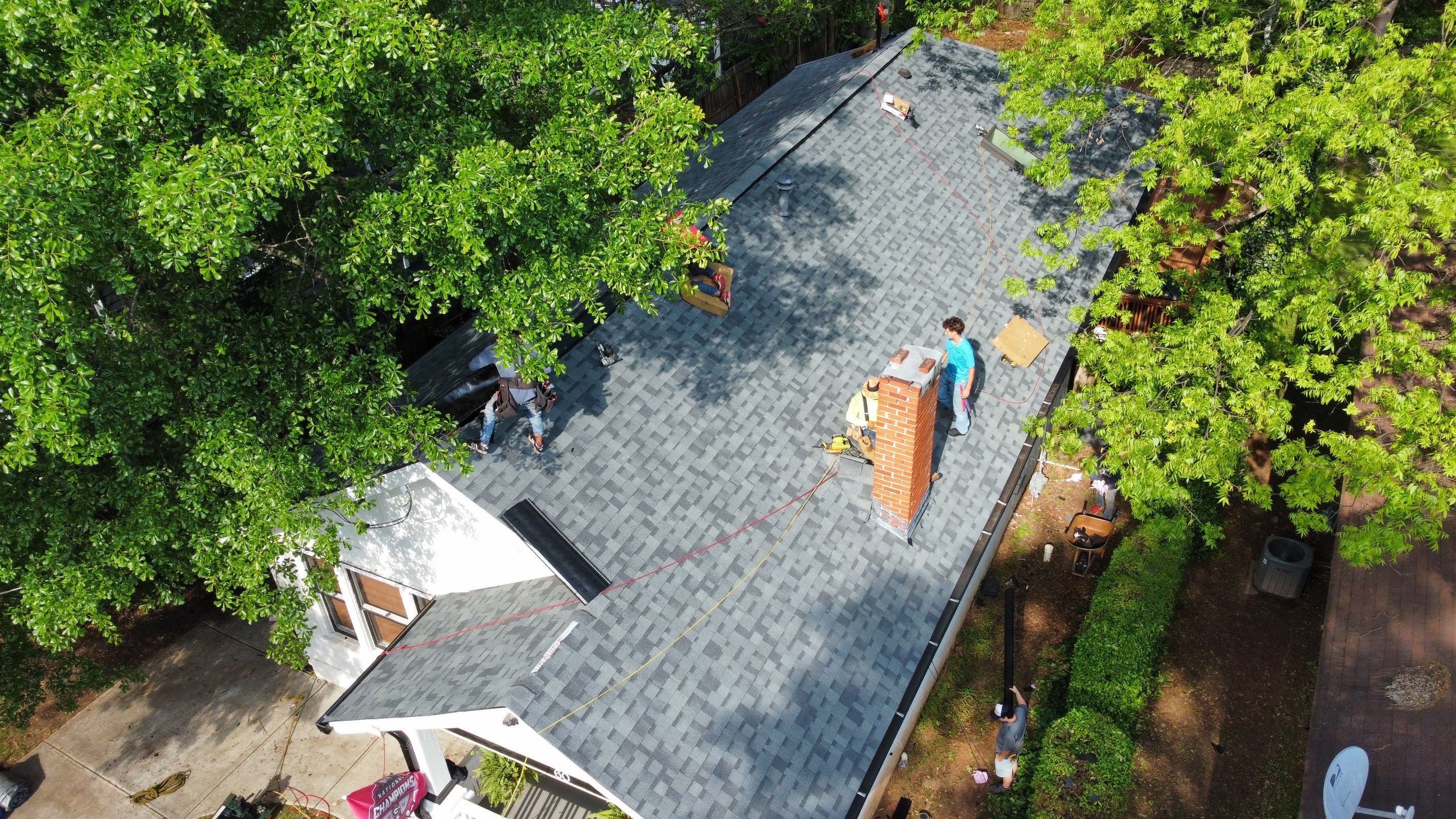 roof replacement and new black gutters by Nailed It Roofing & Remodeling LLC