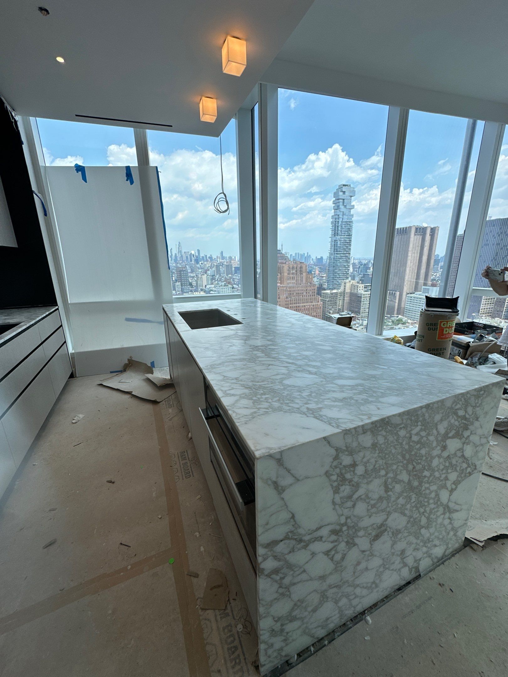 Kitchen Countertop with backsplash and Island top with mitered waterfalls by NC Stone And Tiles