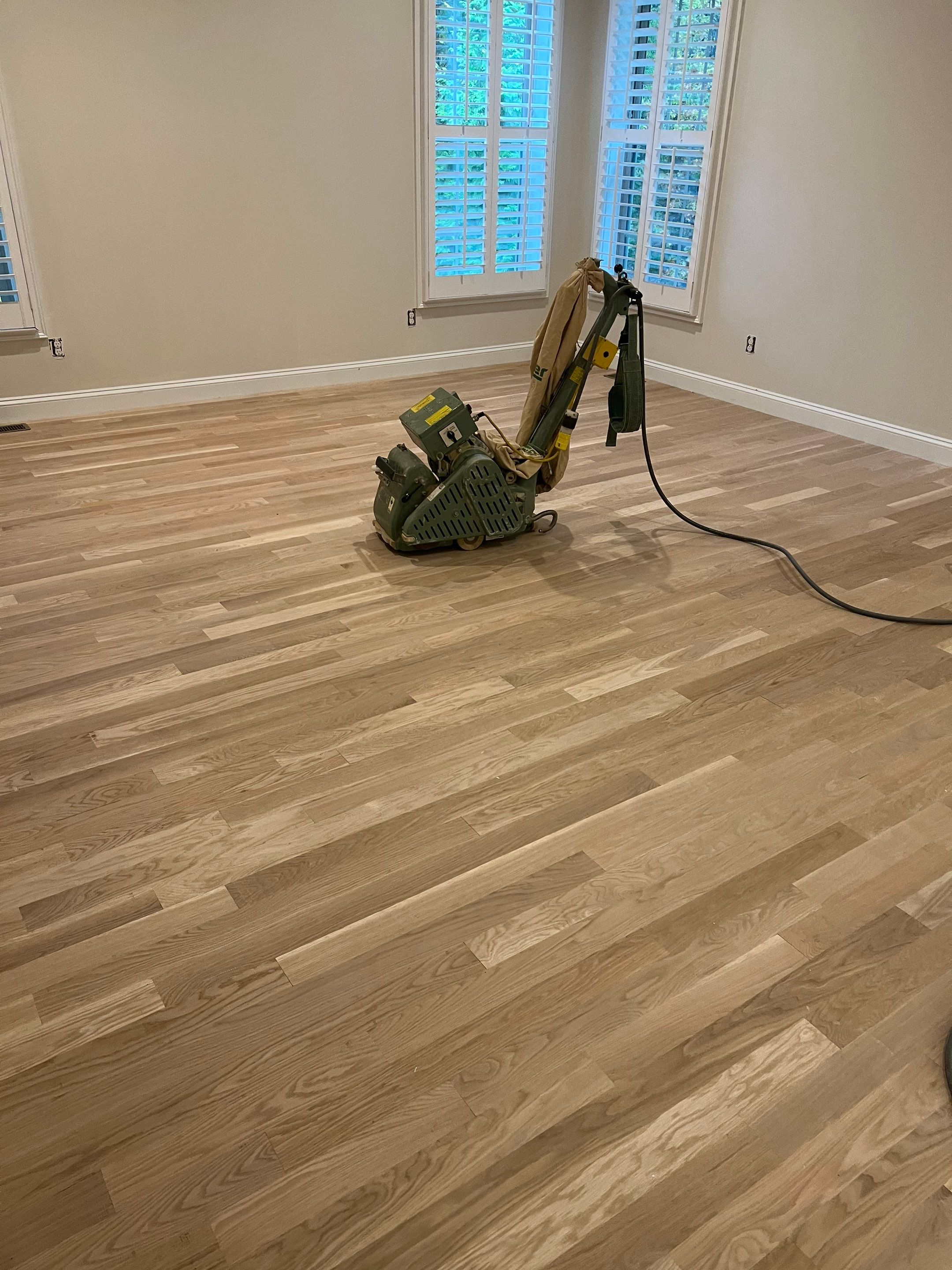 Adding hardwood floors to bedrooms by Accent Custom Floors