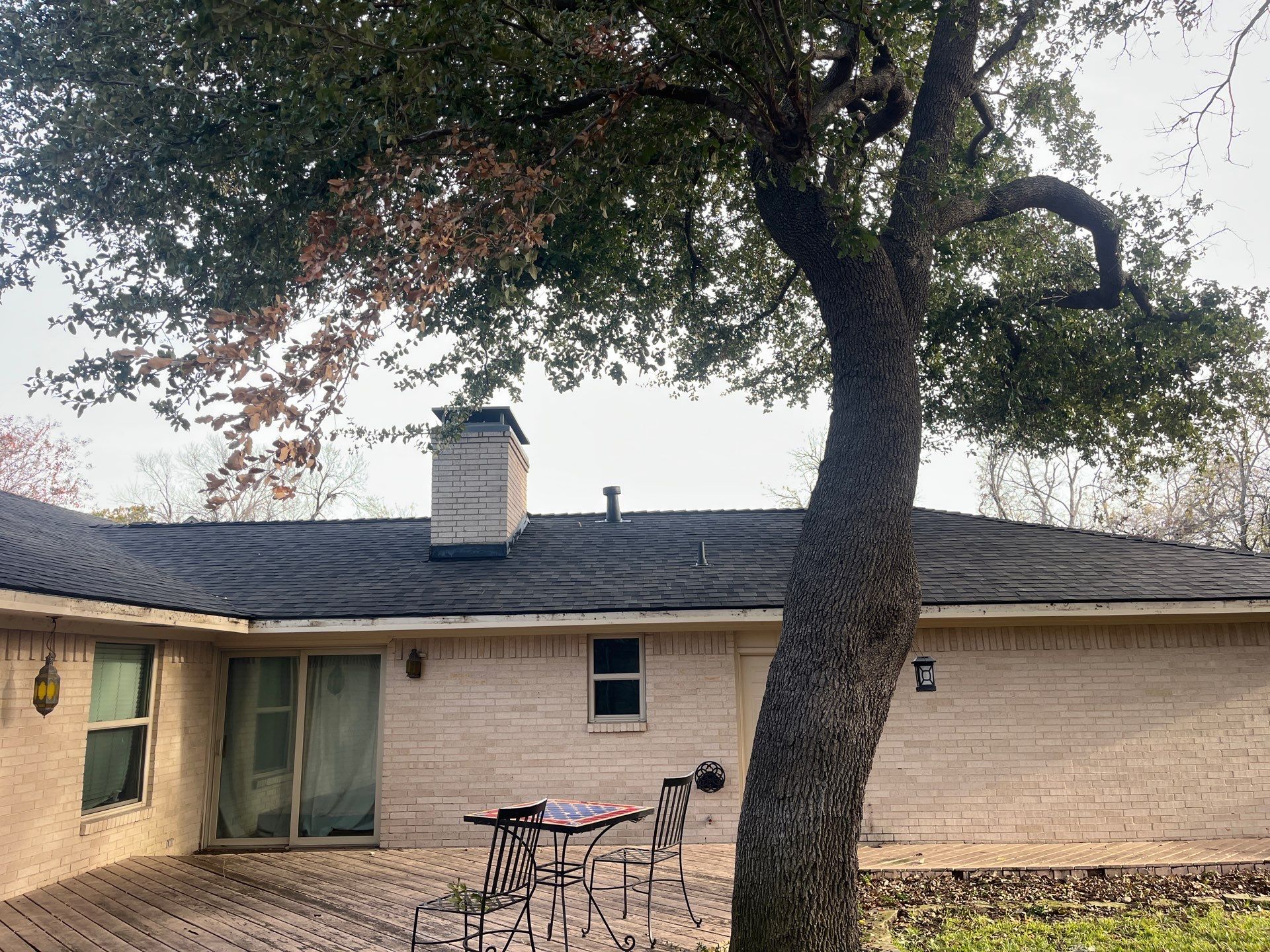 IKO Brownstone- White Brick  by Tejas Roofworks + Restoration