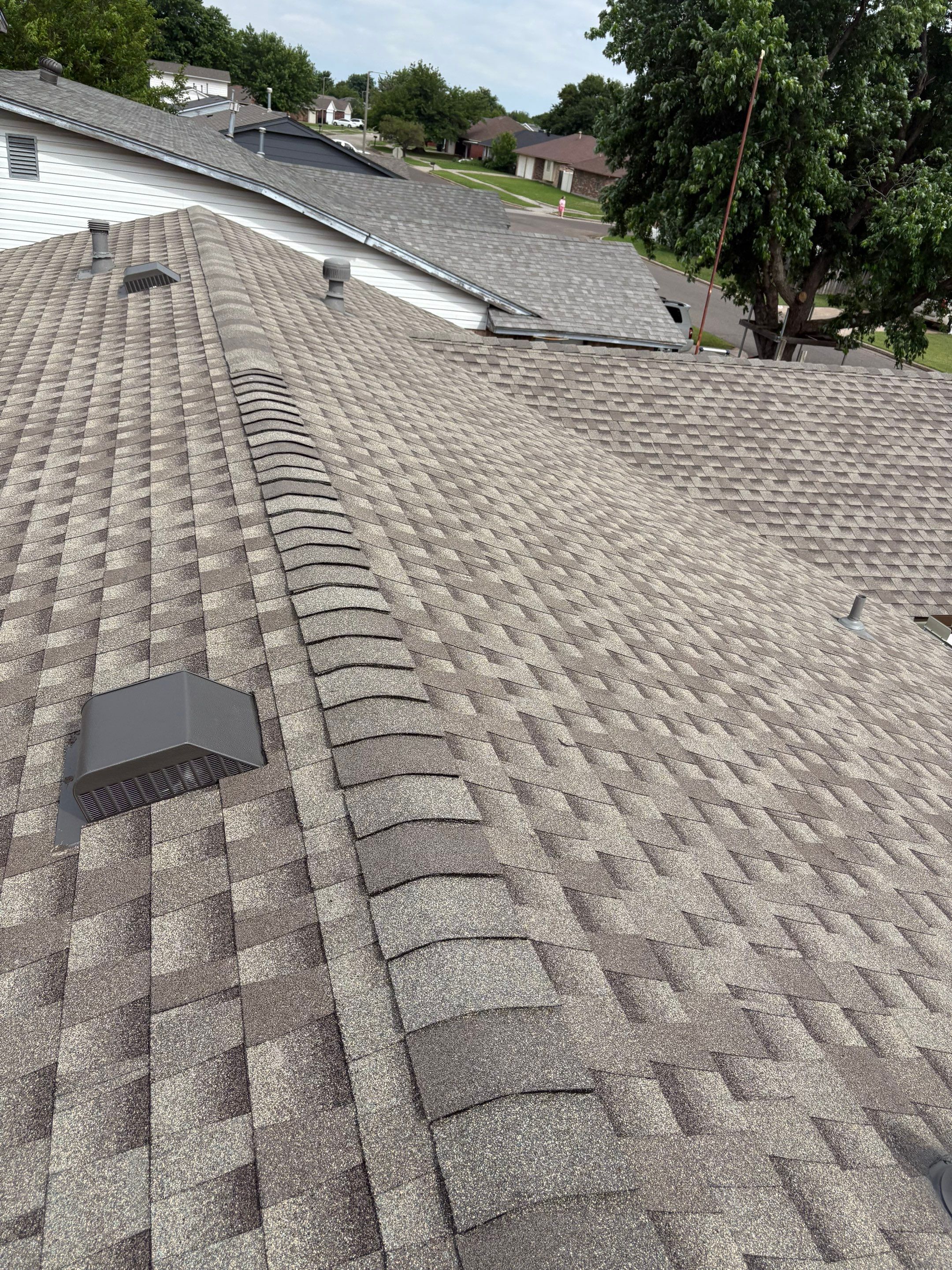 roof replacement & gutter installation in Moore by McCann's Roofing and Construction