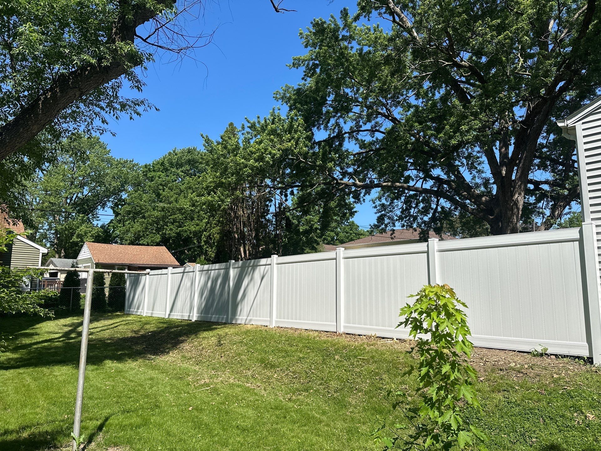 White Vinyl Privacy Fence and Double Gate Installation in Cedar Falls by Perfect Picket Fence and Stain